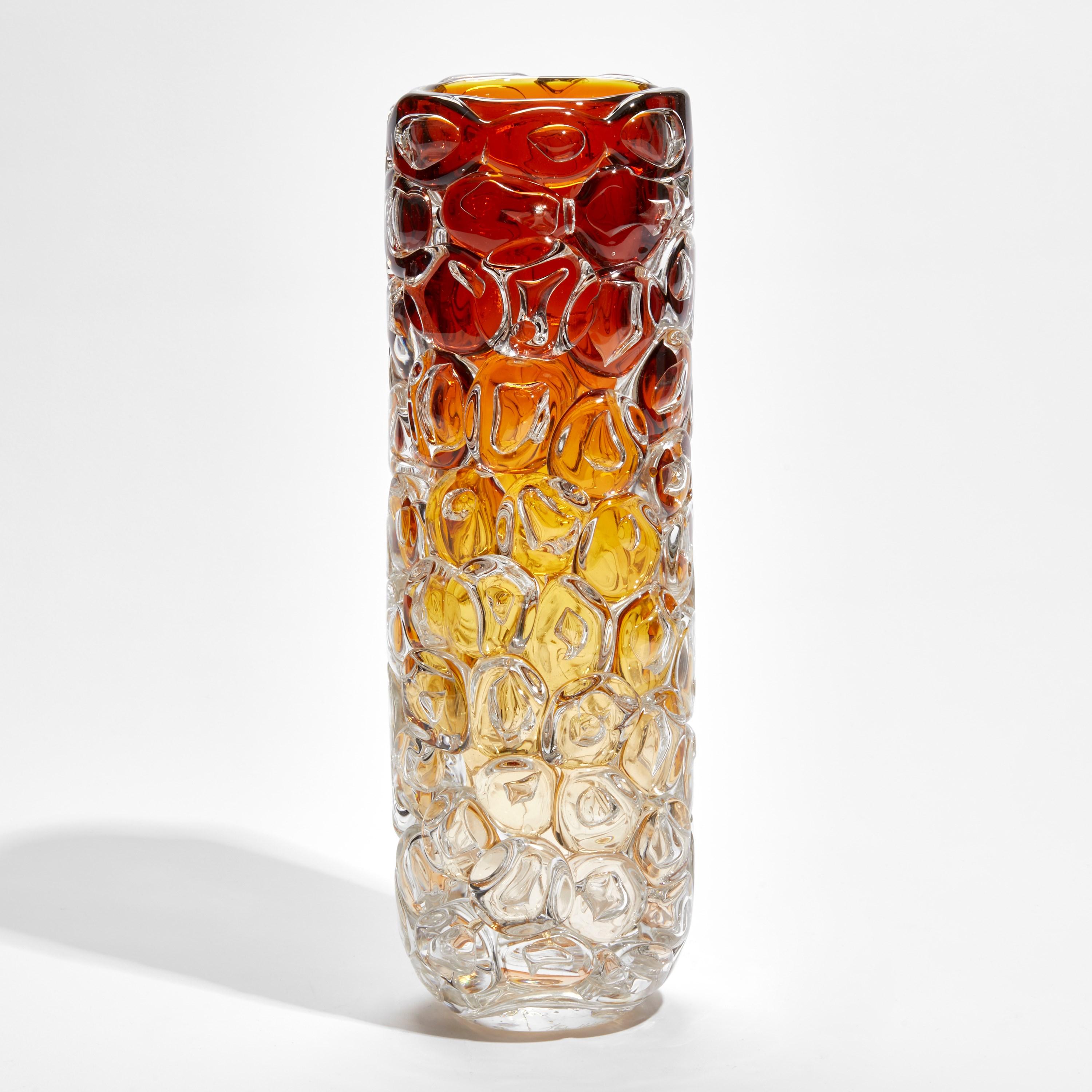 'Bubblewrap in Yellow & Orange' is a handblown and sculpted vase created from rich amber yellow and orange coloured glass by the British artist, Allister Malcolm. Playful yet elegant, Malcolm has formed oversized bubbles on the exterior of this