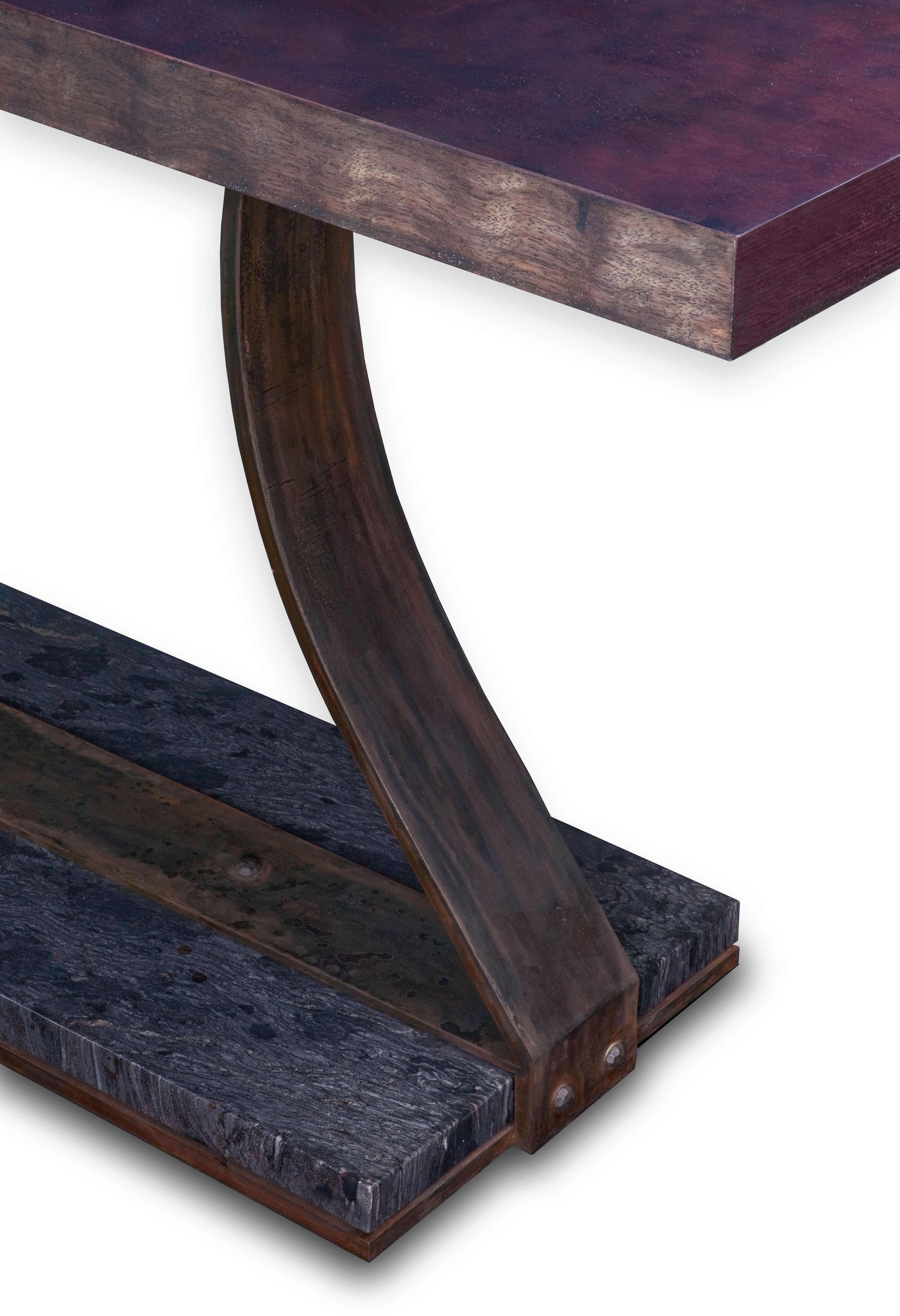 Exotic Bubinga wood top, patinated hand forged steel base which envelopes a heavy slab of granite. A very minimal base for optimal leg room and seating. One of a kind piece available or custom orders available.