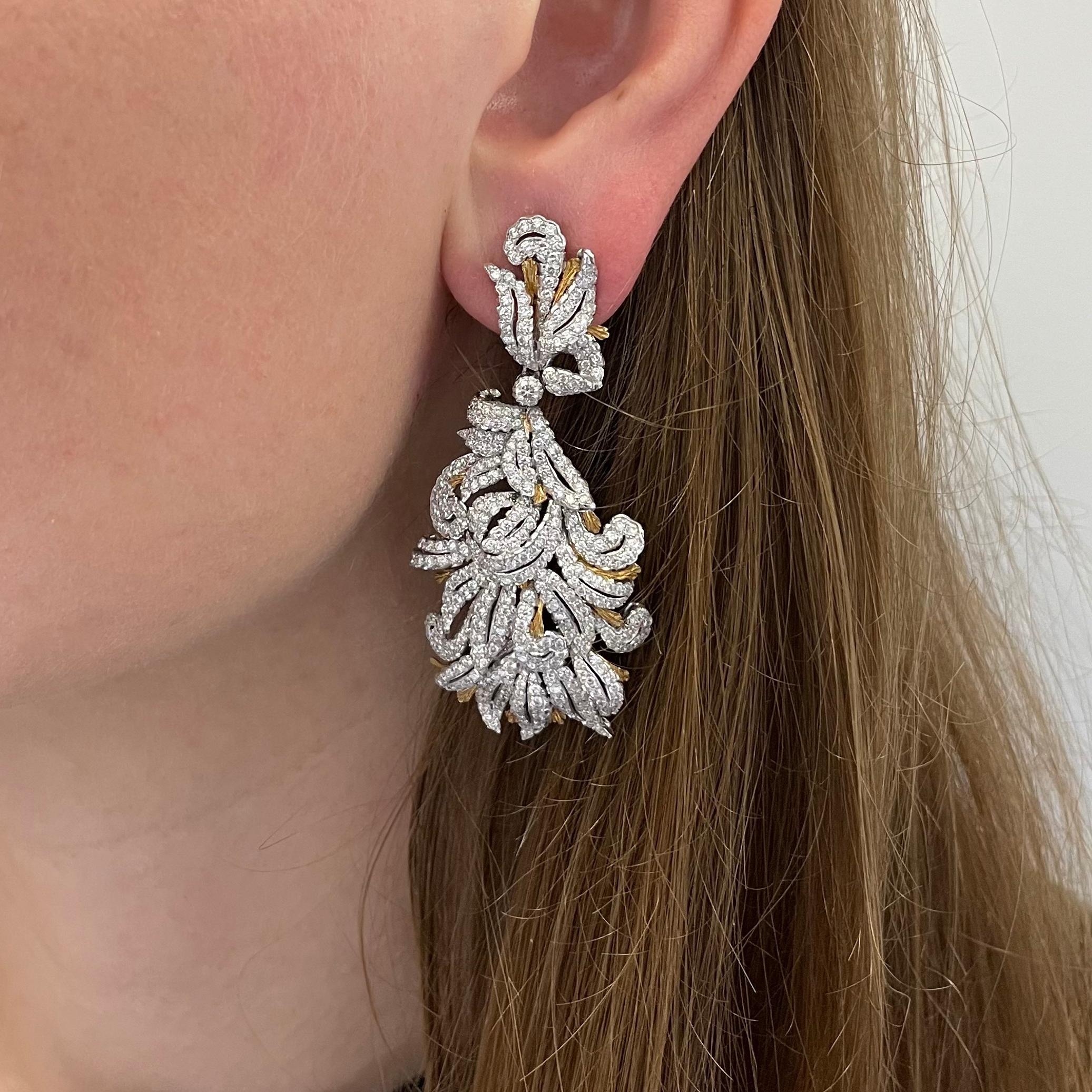 Buccellati Diamond Pendant Day/Night Earrings. This pair of earrings has a flowing floral motif with round diamond weighing of approximately 8 carats total all set in  gold accents. 
Earrings have omega backs and pendant drops are detachable for day