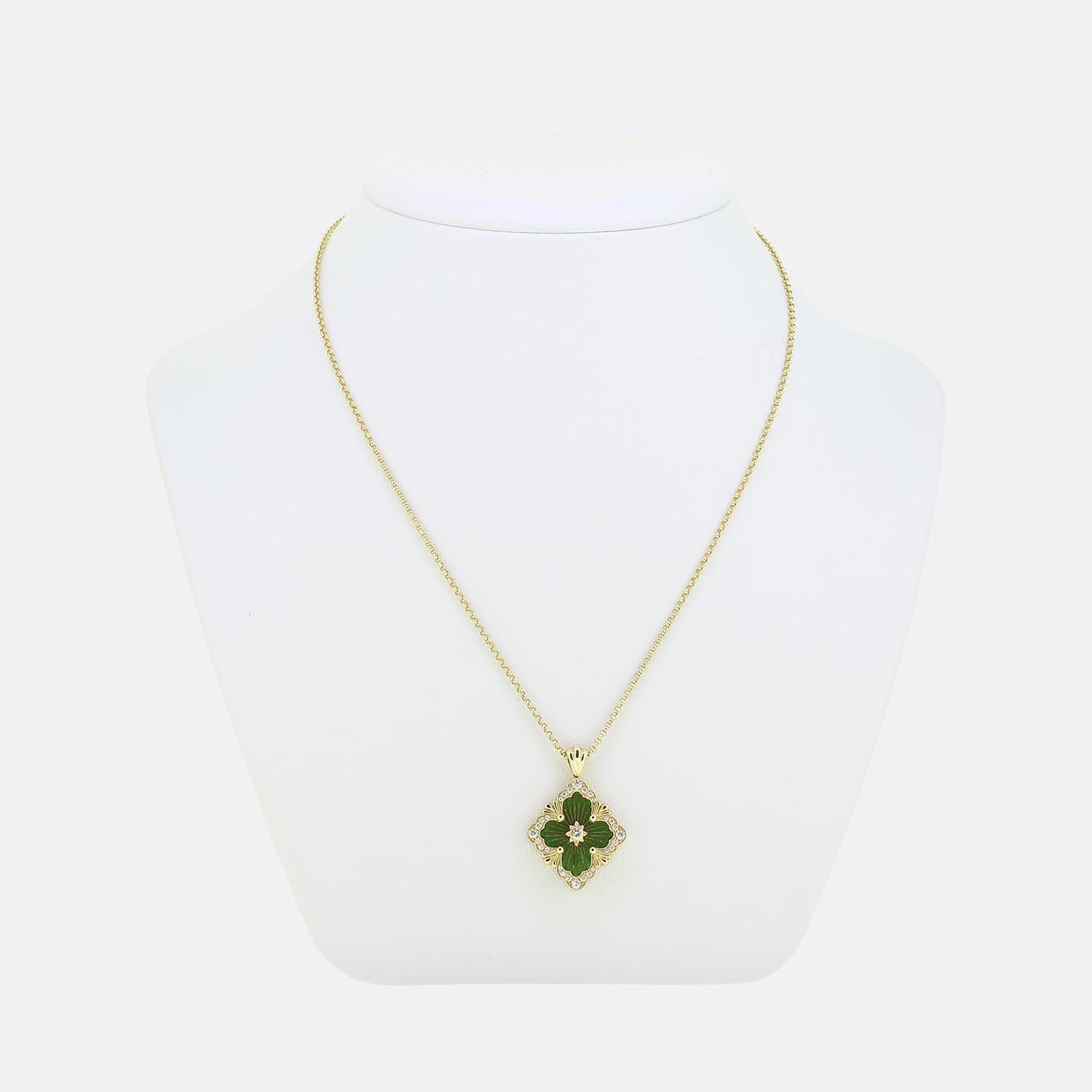Here we have an Opera Tulle pendant necklace from Buccalleti. This iconic piece is composed of an 18ct yellow gold logo element, green enamel background topped with radial tulle and finished by a diamond set rosette centre. Scalloped fan-shaped