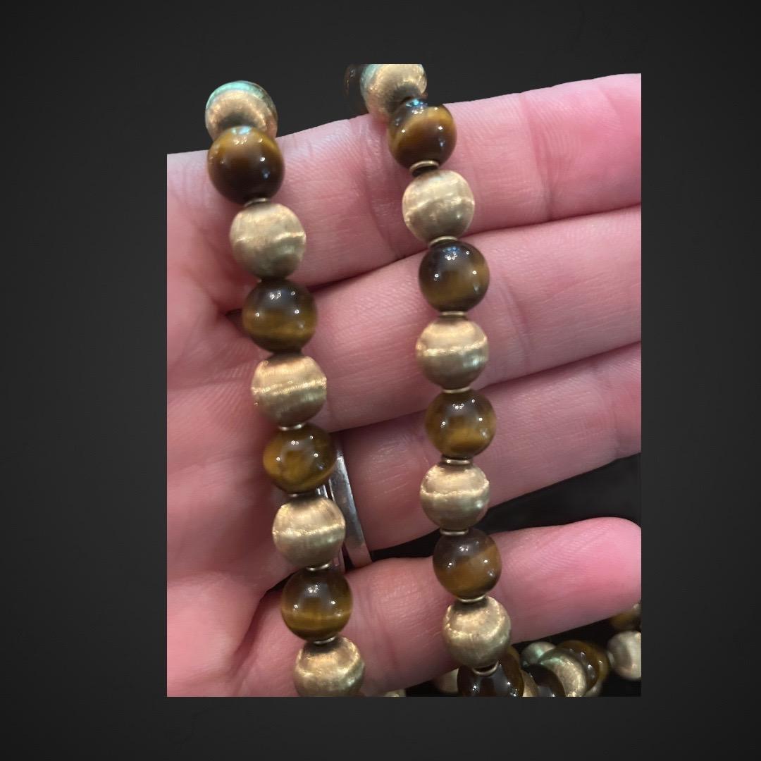 Mario Buccellati Double Strand Gold and Tiger's Eye Bead Necklace. Mario is known for his exceptional gold work which is highlighted in this amazing necklace with the gold ball accents which match perfectly with the tiger's eye beads with very good