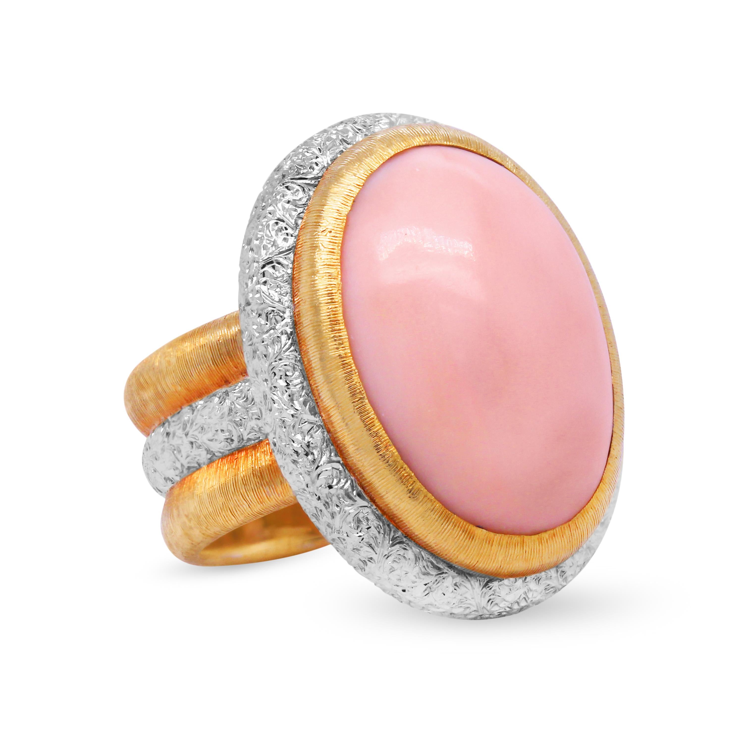 Buccellati 18 Karat Yellow White Gold Oval Cut Angel Coral Ring 

This incredible ring by Buccellati features an angel coral center with brushed yellow and textured white gold hand work shown all throughout.

Ring face is 23mm x 18mm. 9mm band