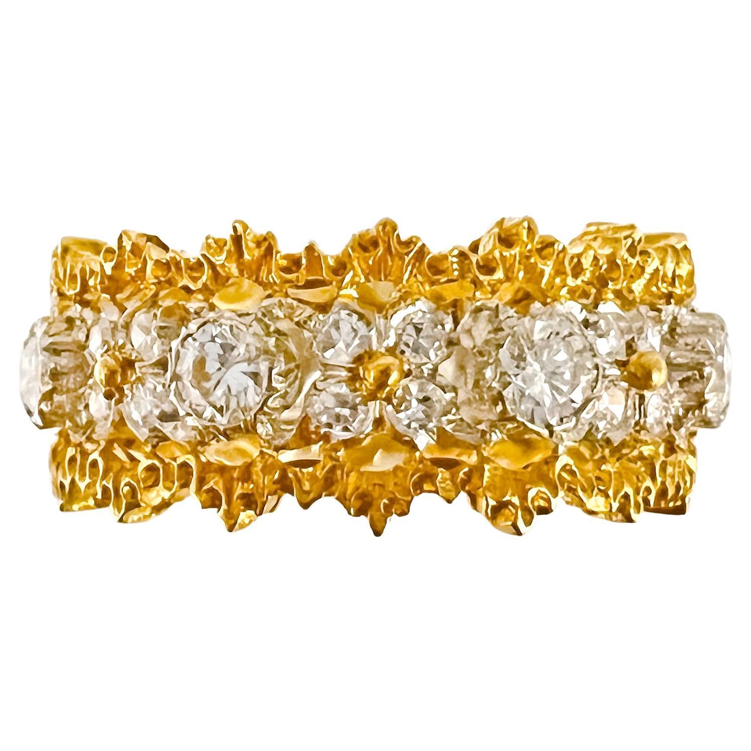 Buccellati 18k yellow and white gold diamond 'Eternelle' band ring.  Yellow gold engraved border with a pierced, cut-out design white gold center having eight larger bezel set diamonds and thirty-two smaller round brilliant-cut diamonds weighing