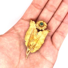 Buccellati Broche fleur en or 18 carats et émeraude