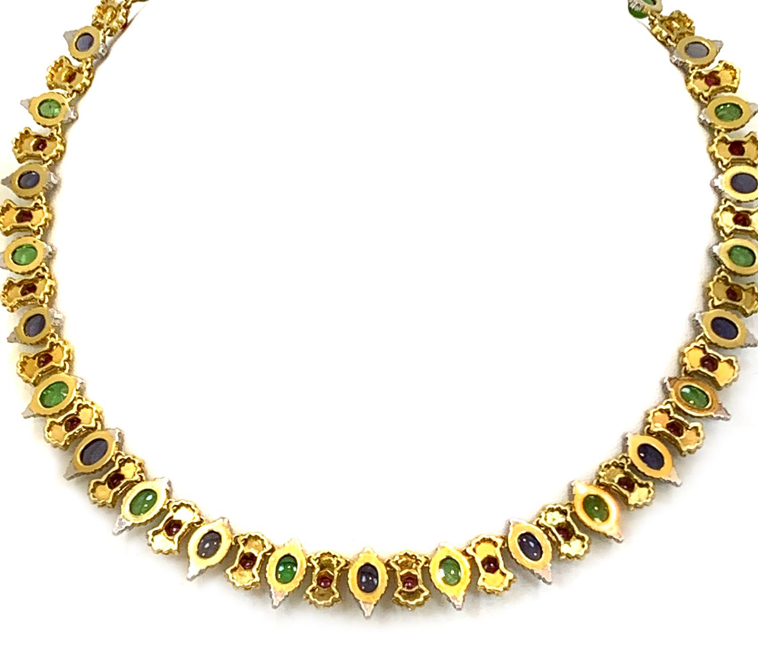 Signed Buccellati
 18k yellow gold necklace with (14) cabochon sapphires.
Gemstone- Peridot, Sapphire and Ruby 
Width- 5.6 inches
Length- 6.95 iches
Weight- 51.6 g
Hallmark-N/A
Place of Origin- Italy
Condition- Pre-owned/ Excellent
Item No-