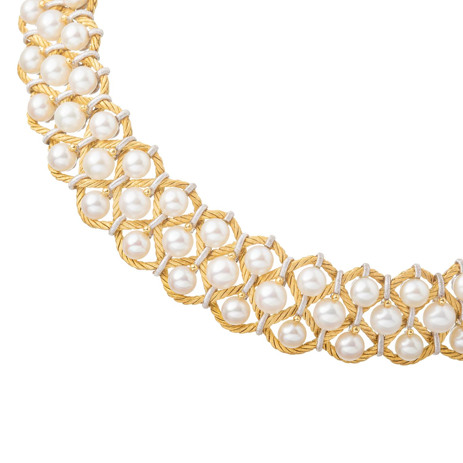 This 'Rete' pearl collar necklace by Italian designer Buccellati has a triple row of cultured pearls set in a braided woven design.  The flexible collar measures approximately 20mm wide and 15 inches long.  Set with one hundred-three round Akoya