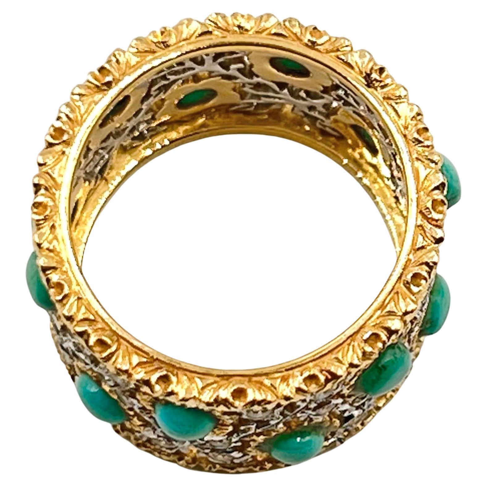 Turquoise and diamond wide band ring, featuring an openwork leaf and flower pattern in 18k white and yellow gold set with small round-cut diamonds and cabochon-cut turquoise. 36 round diamonds weighing approximately 0.36 total carats and twelve