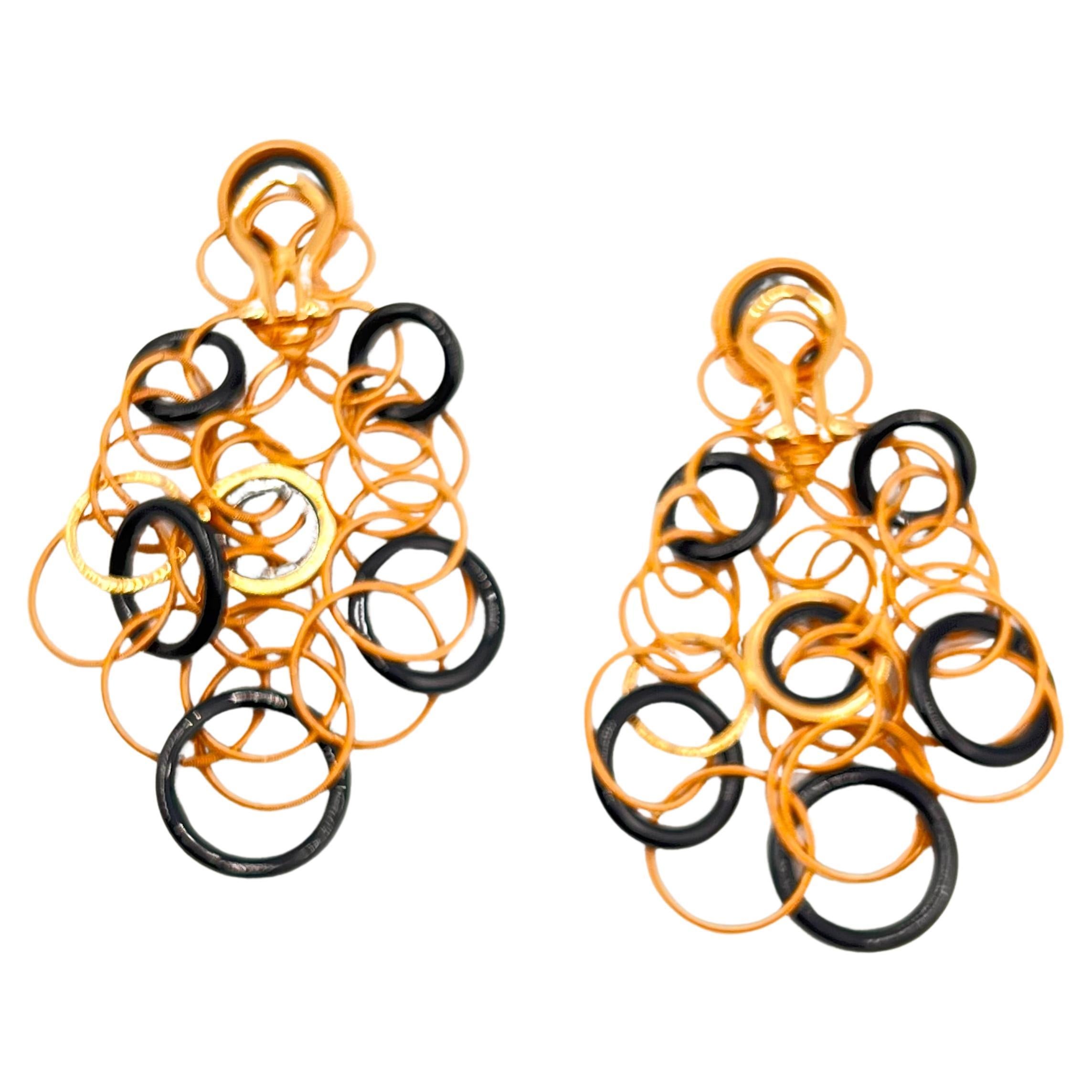 18-karat rose gold multi-loop earrings with black onyx accents, from the Buccellati Hawaii collection. Measuring 2.76