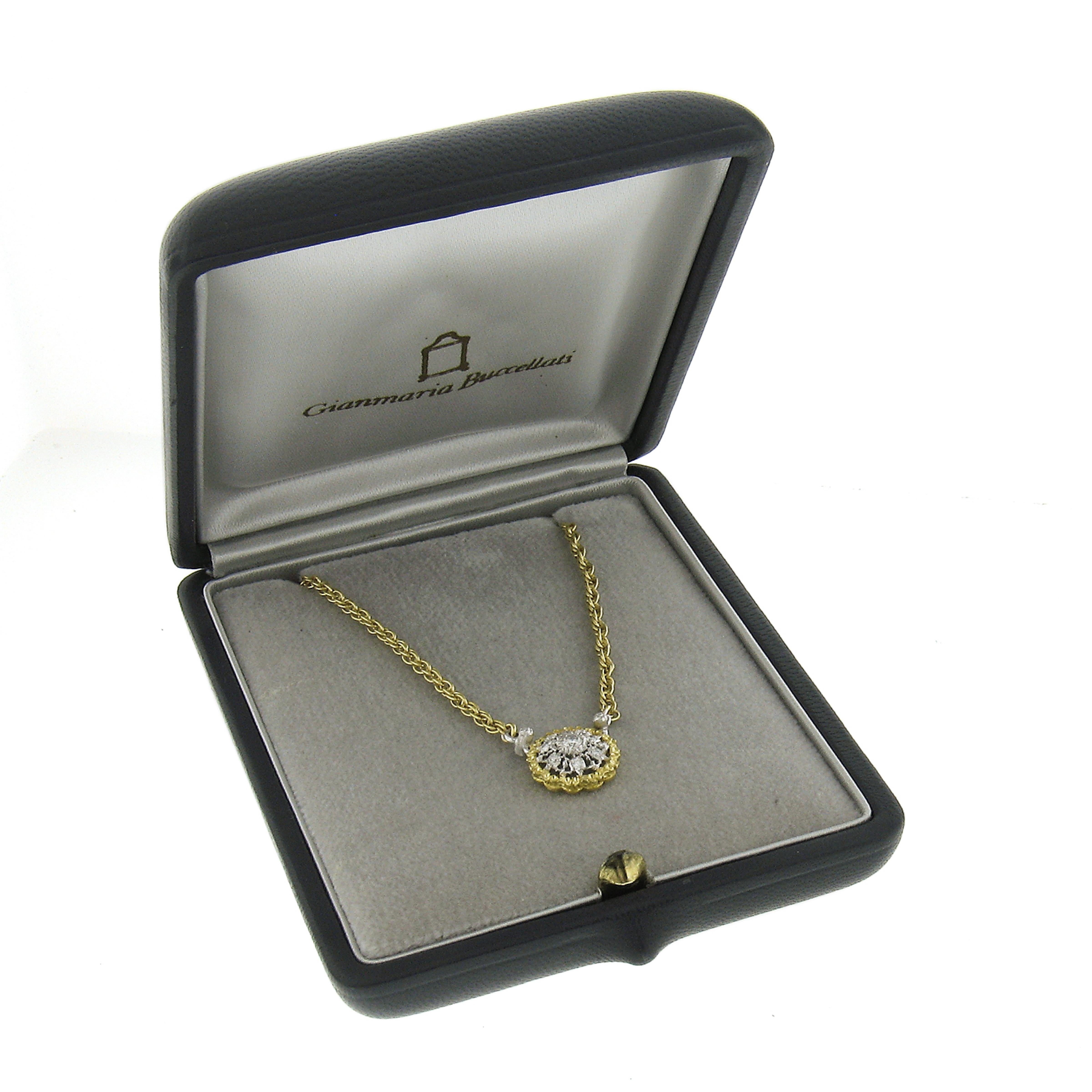 This adorable Italian diamond pendant necklace by Buccellati is crafted in solid 18k yellow gold with white gold accents and features a cluster of 7 fiery brilliant and sparkly round brilliant cut diamonds pave set in the adorable cluster circle