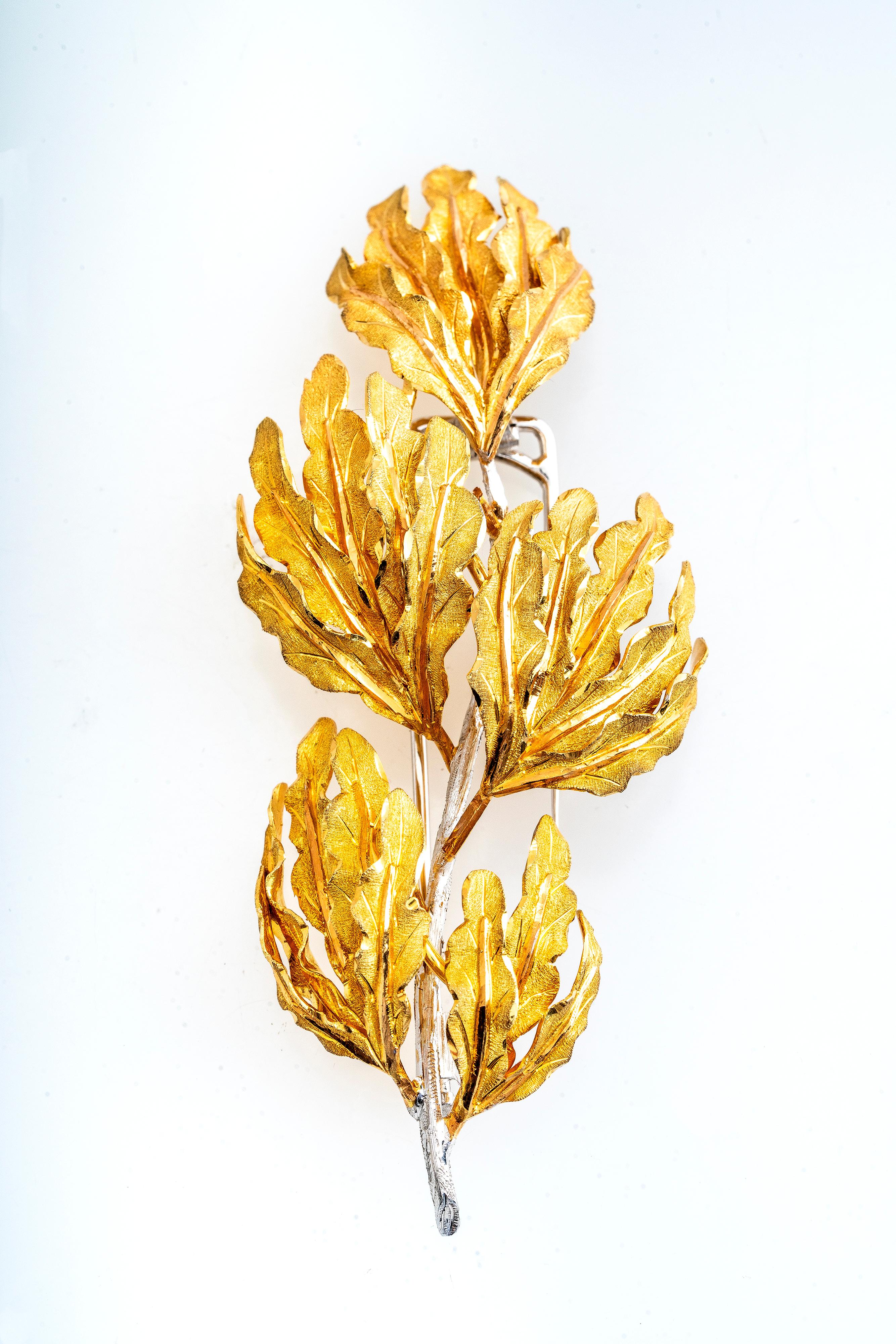 Vintage 18k yellow and white gold oak leaf brooch and fur pin by Italian design house, Buccellati.   Beautiful and intricate detailing with refined craftsmanship.  Buccellati had been creating works of art for over 100 years and their distinctive