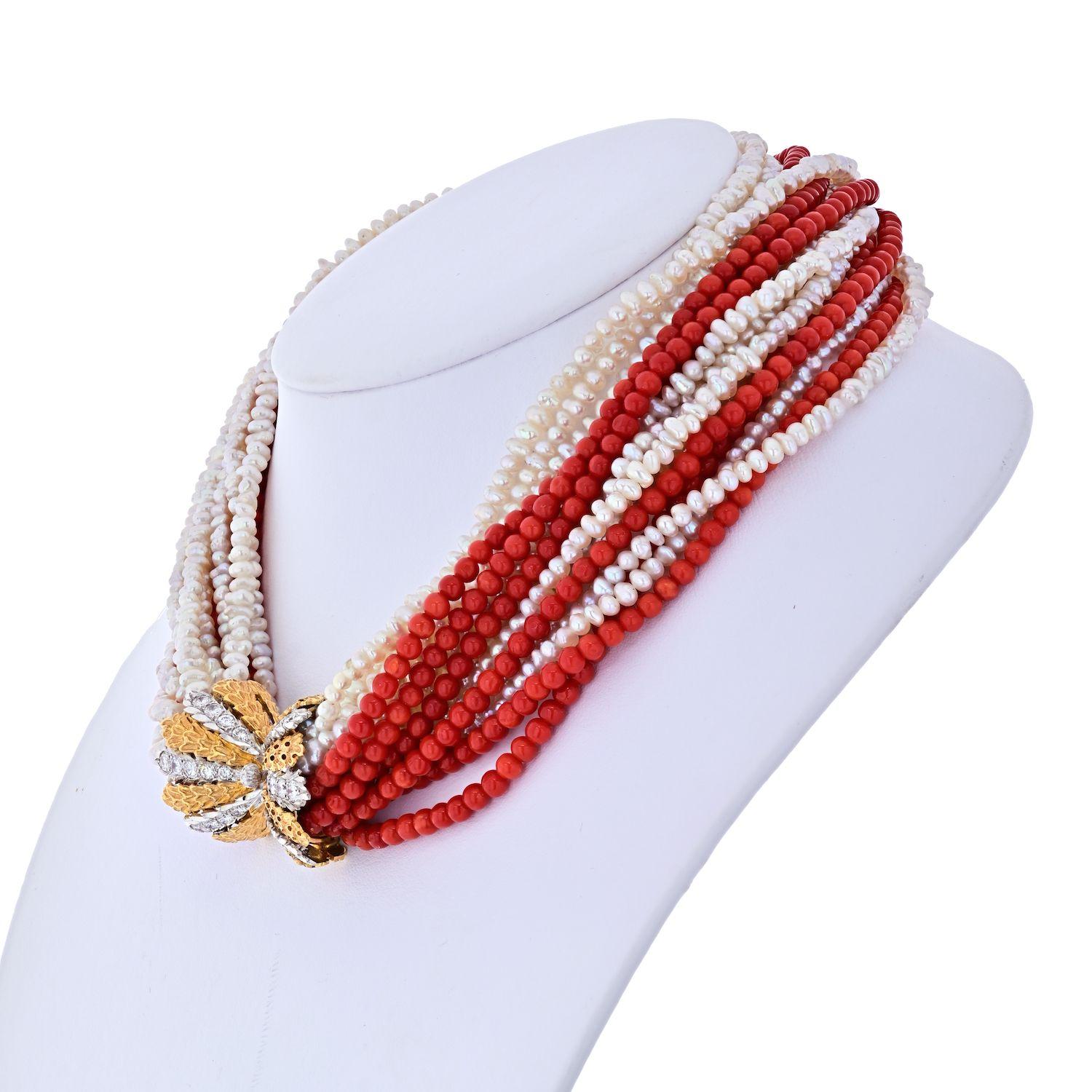 Fabulous elegant necklace created by Mario Buccellati in Italy in the 1950's. Features ten strands of white freshwater pearls and six strands of Mediterranean coral connected with a diamond and yellow & white gold clasp. The necklace has a lot of