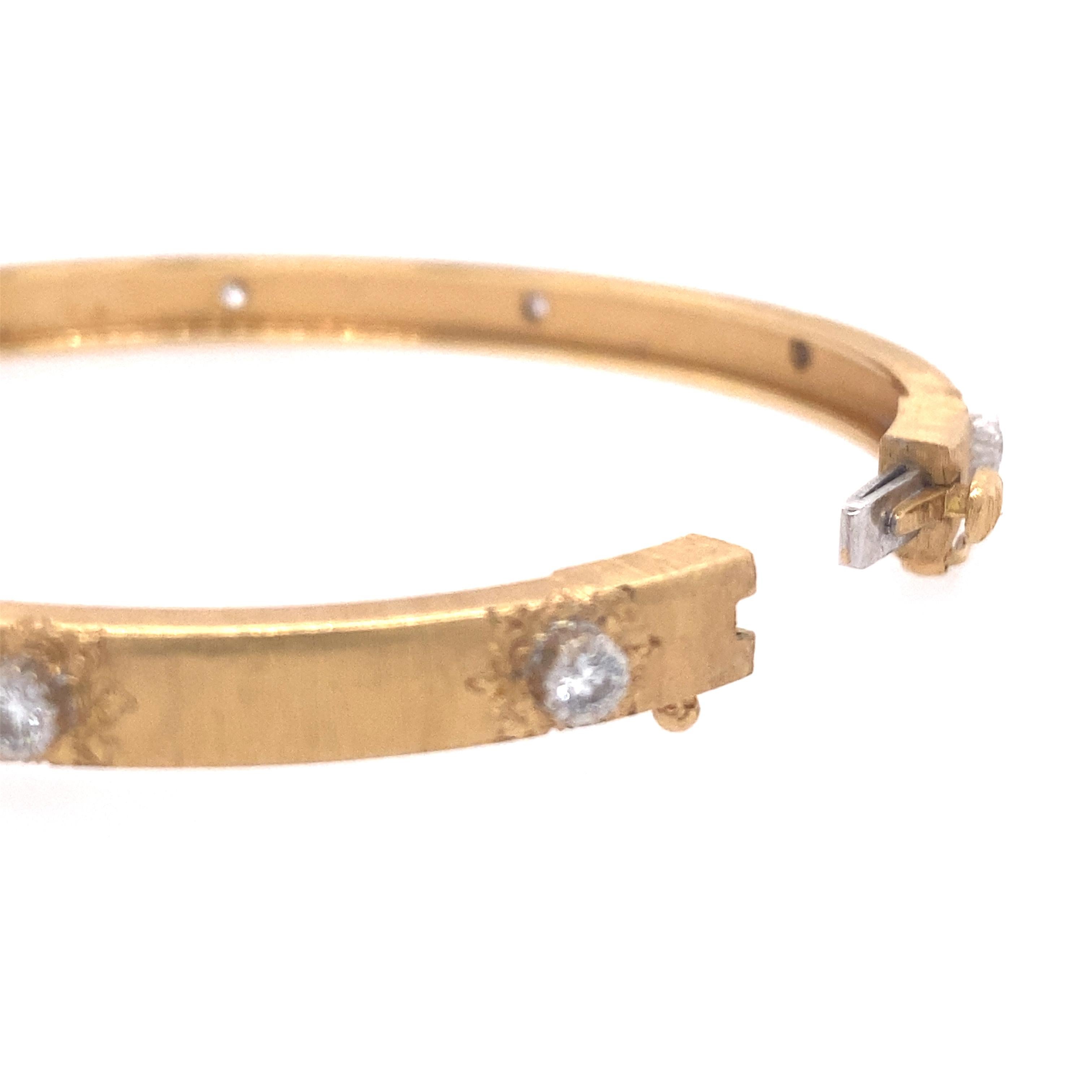 Buccellati 18k Yellow gold and diamond 'Marci Classica' Bangle Bracelet
Consisting of a brushed and engraved gold bangle containing 10 round brilliant cut diamonds weighing approximately 0.45 carat total, 
hinged with side clasp. 6 inches inner