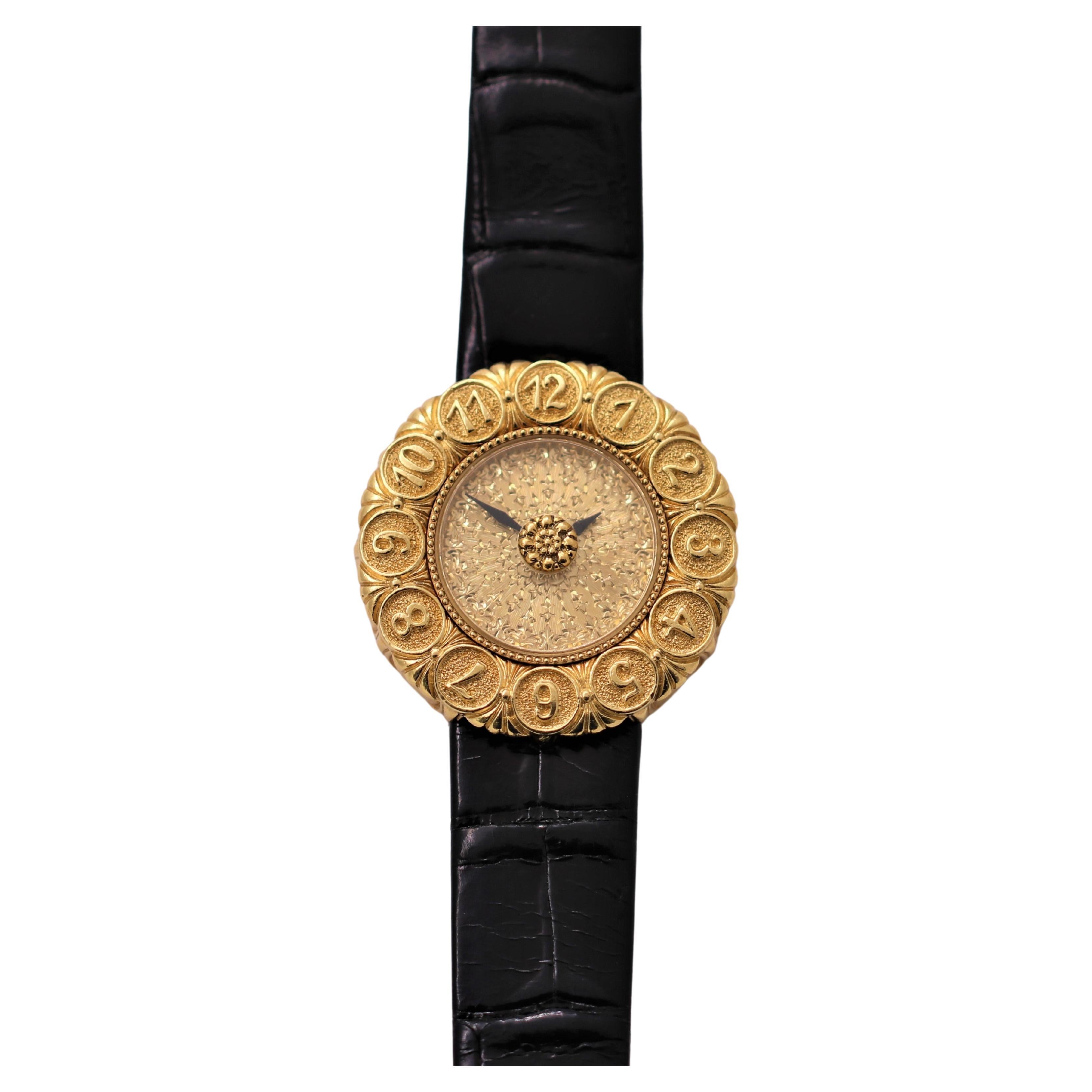 This lovely Gianmaria Buccellati ladies Eliochron wrist watch is extremely detailed, aesthetic and feminine..  With it's richly worked dial, to the large and stylized hour markers on the bezel, to the delicately sculpted case sides, every surface