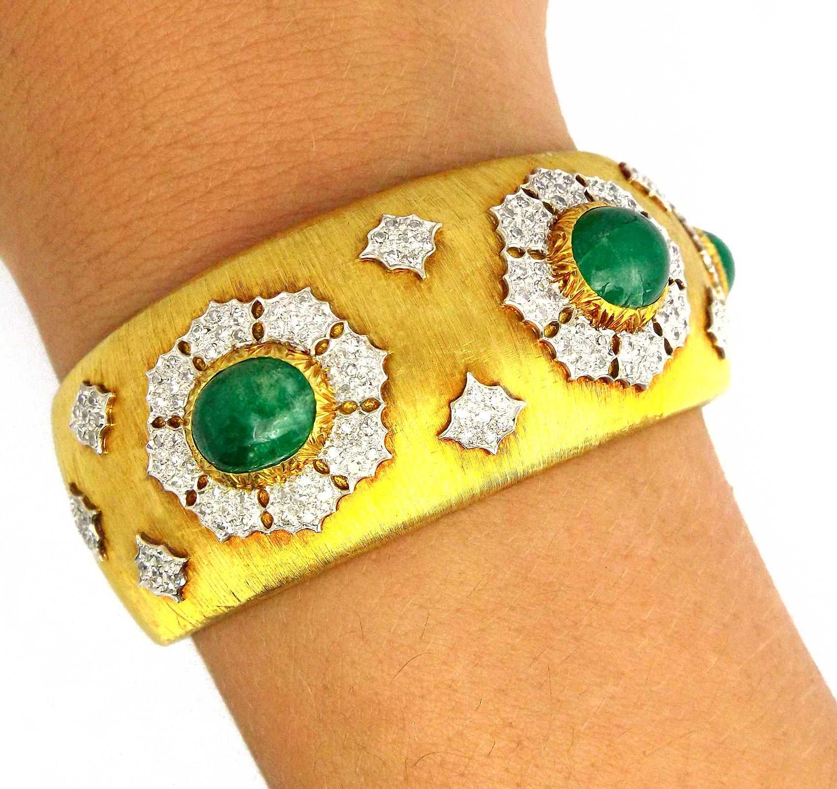 A vintage cuff bracelet by Buccellati, made of 18K yellow gold, featuring cabochon emeralds and diamonds set in 18K white gold. Diamond weight is approximately 4.5ct, inner circumference is approximately 6.25 inches, weight is 55.7 grams. Signed