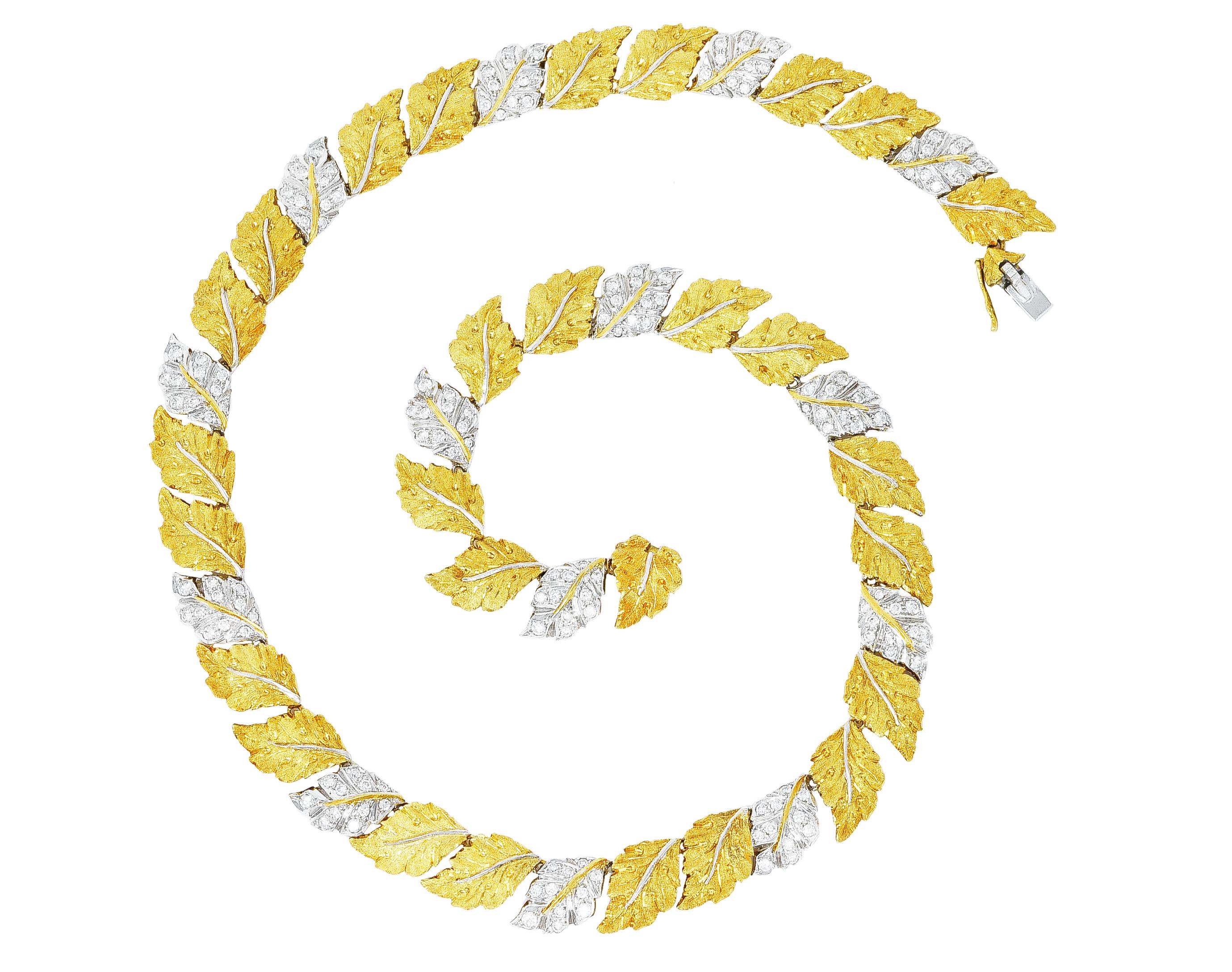 Necklace is designed as a garland of birch leaves in a pattern of alternating two-tone gold. Featuring round brilliant cut diamonds bead set in white gold leaves. Weighing approximately 3.08 carats total - G/H in color with VS2 clarity.
With fine