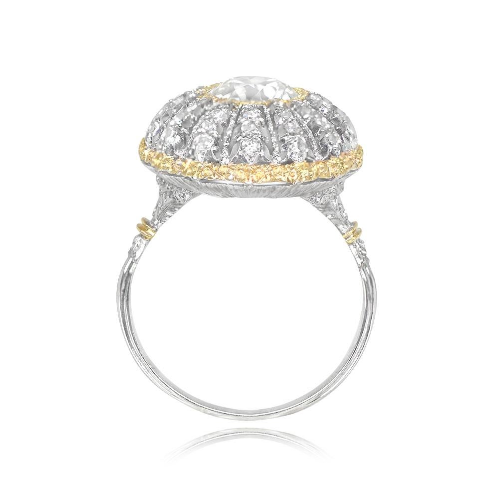 This exquisite Buccellati ring features a central 2.01-carat old European cut diamond with J color and VS1 clarity. The diamond is elegantly complemented by yellow-gold accents. The openwork mounting is adorned with a starburst design created with