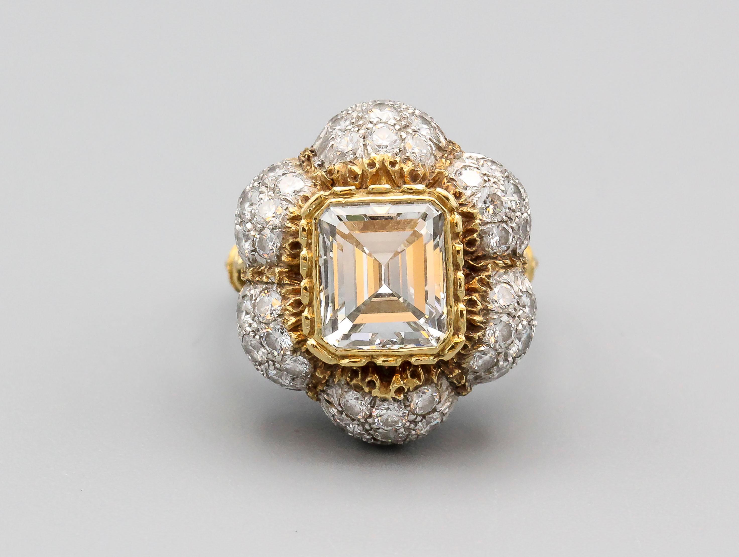 Very fine diamond and two-tone 18k gold ring by Federico Buccellati. This stunning ring features a high grade emerald cut diamond center stone of approx. 3.0 cts in weight, approx. measurements 9mm length by 8mm width by 5mm depth; as well as high