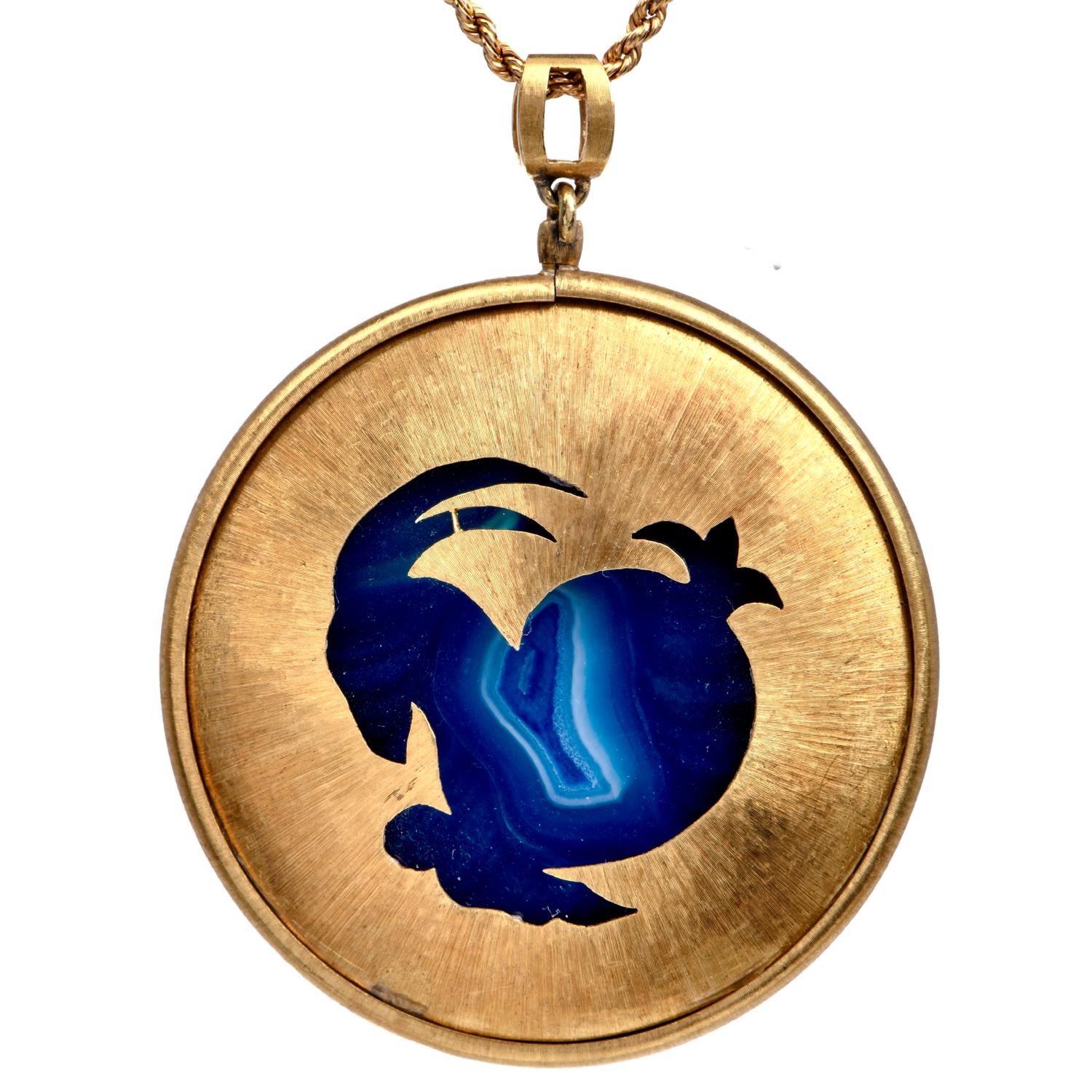 Presenting a captivating Vintage Medallion pendant crafted by the esteemed Buccellati in 18K Italian yellow gold. This pendant features a generously sized blue natural agate nestled within a round frame, characterized by its exquisite silhouette and