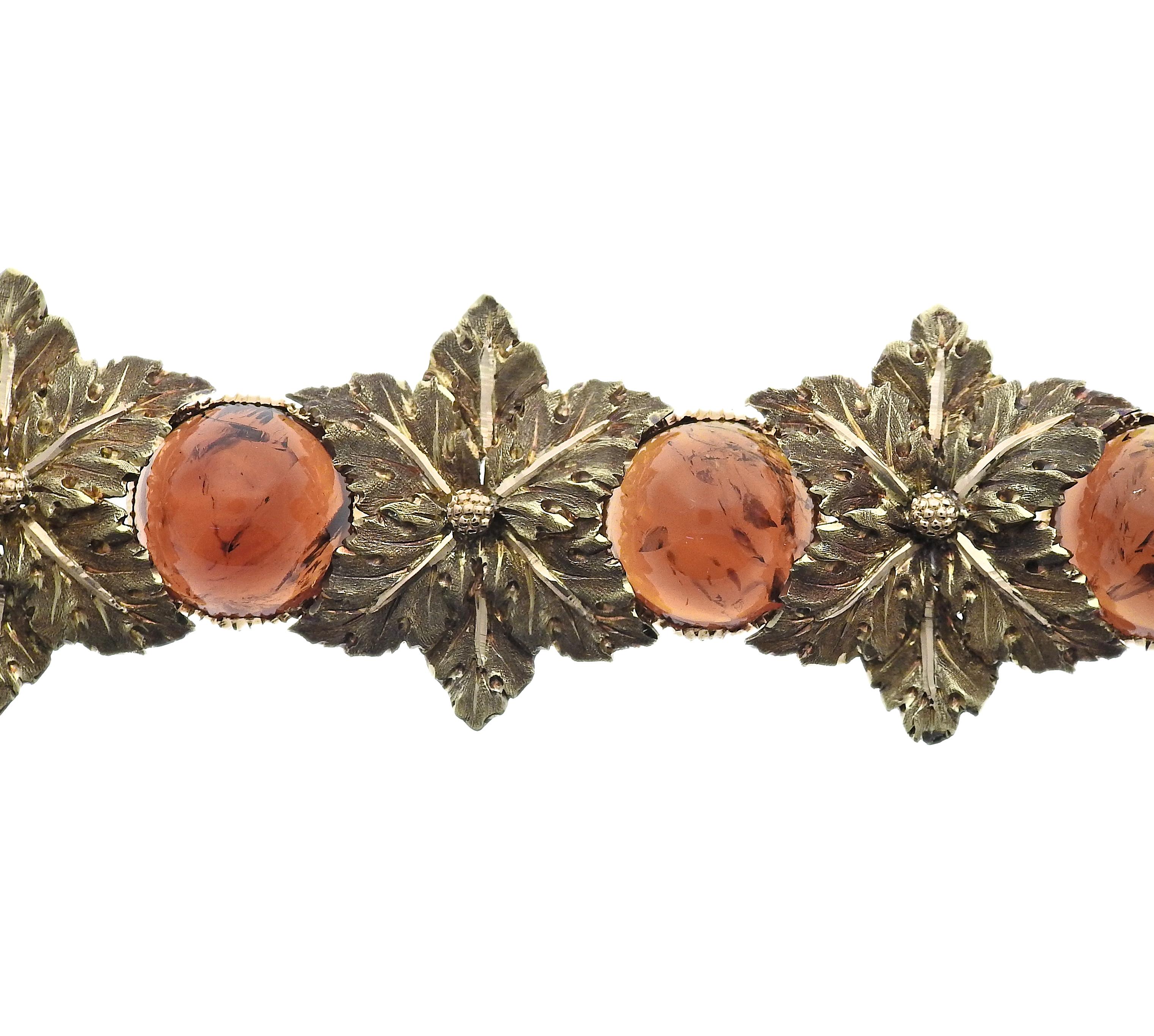 18k yellow gold leaf motif bracelet by Buccellati set with amber. Bracelet measures 7