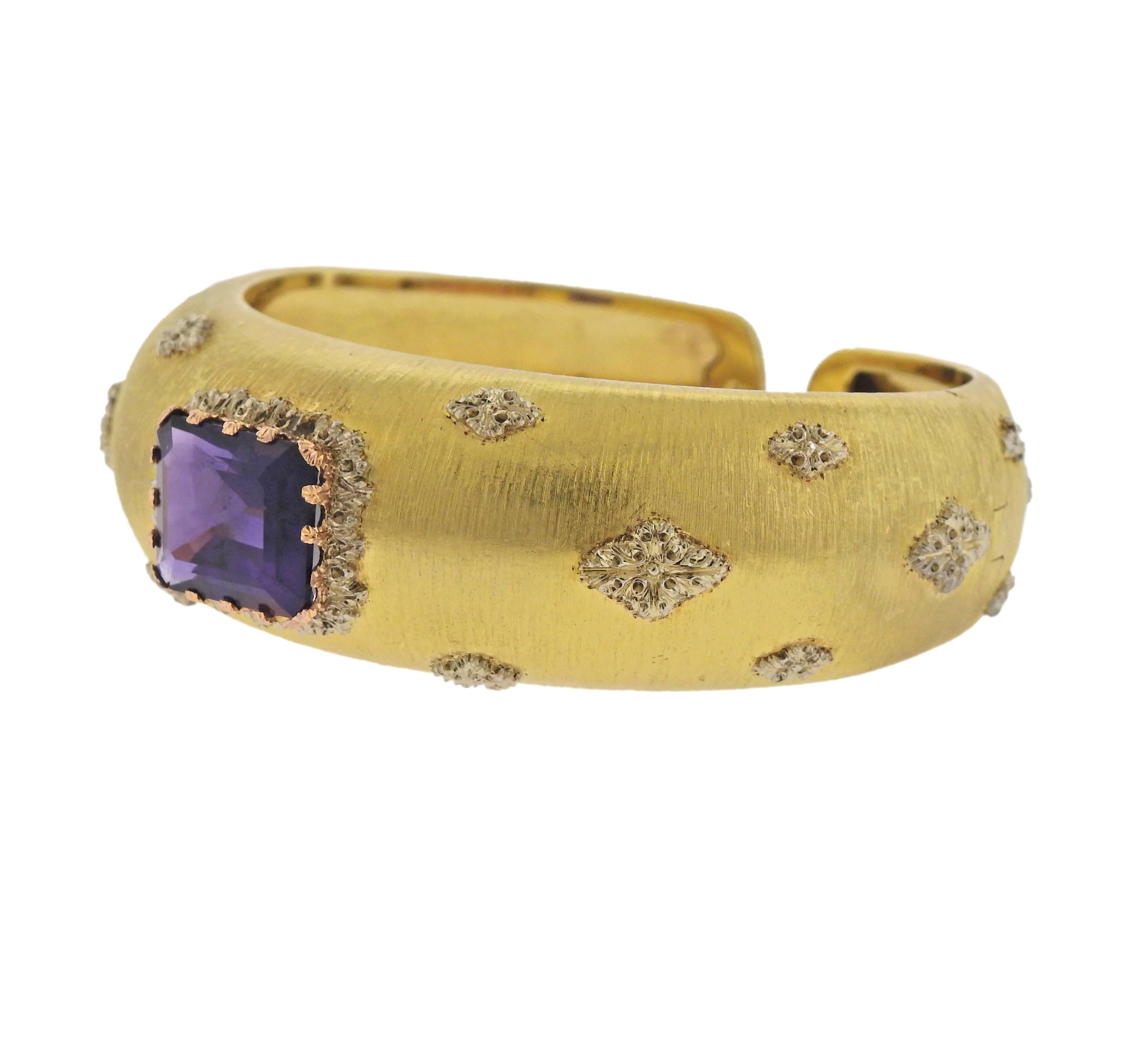 18k yellow gold cuff bracelet by Buccellati, featuring approx. 10ct amethyst. Bracelet will fit approx. 6.75