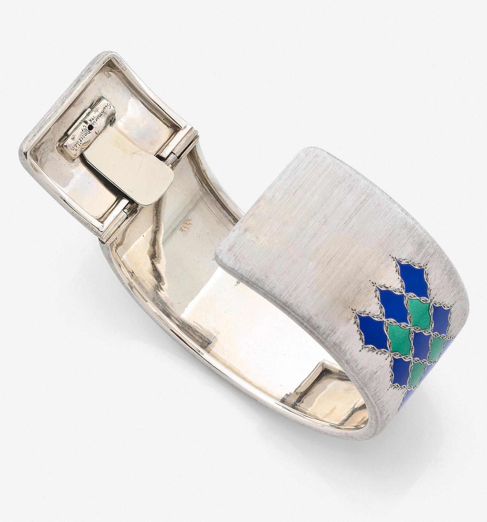 Buccellati, Gianmaria (1929-2015)
Rare Vintage finely chiseled Silver (Marked), with blue and green enamel diamond patterns, Manufactured C. 1970.
Signed Gianmaria Buccellati Italy, 
Inner Circumference : 18,5cm
In very good condition

Beautiful and