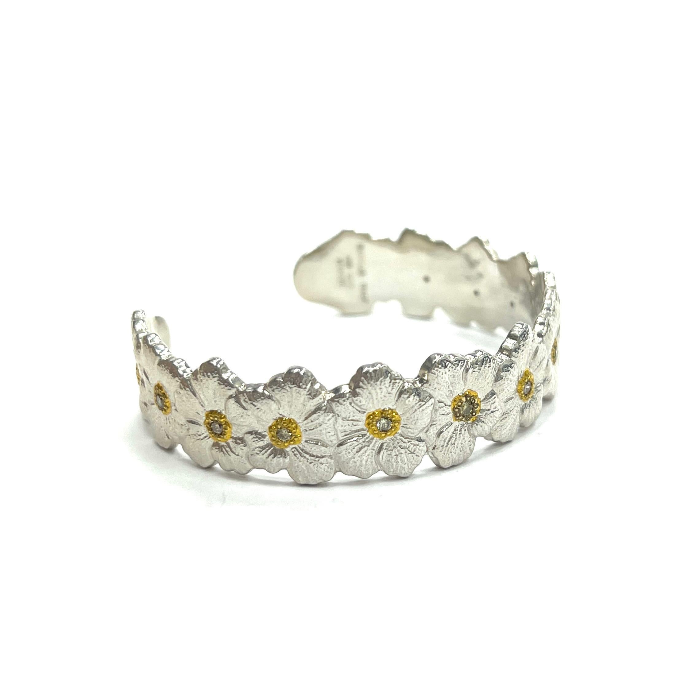 Buccellati Blossoms Diamond Cuff Bracelet, Italian

Blossom flowers made of sterling silver, round-cut diamonds of approximately 0.30 carat; marked Buccellati, Italy, 925, Sterling

Size: width 0.63 inch; inner circumference 6.75 inches
Total