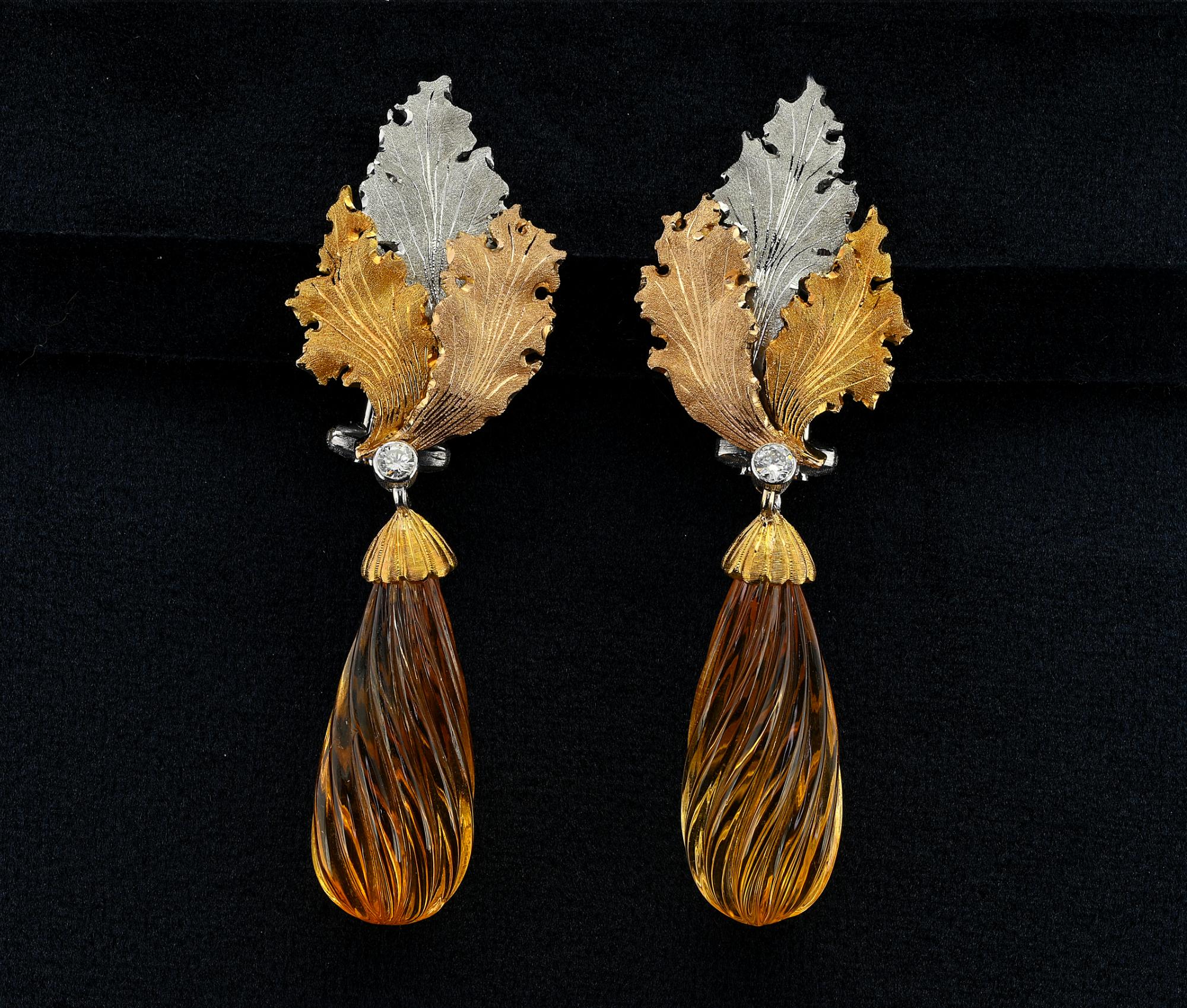 Charming pair of long drop earrings, Signed Buccellati,1980 circa
Each in foliate design made of solid 18 KT white and yellow, set with round brilliant cut diamond
Suspending a carved Citrine drop of lovely color Diamond approx 24.0 Carats for both
