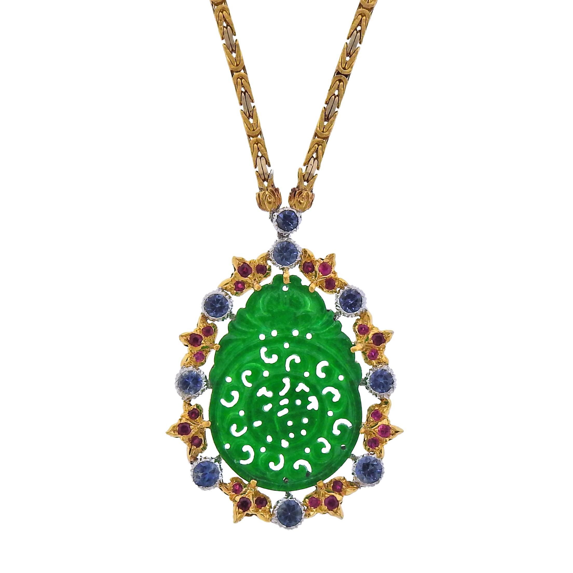 Buccellati 18k gold pendant necklace, with carved 5.80ct jade, 0.55ctw in rubies and 1.98ctw in blue sapphires. Retail $29500. Comes with Buccellati paperwork.  Necklace is 19