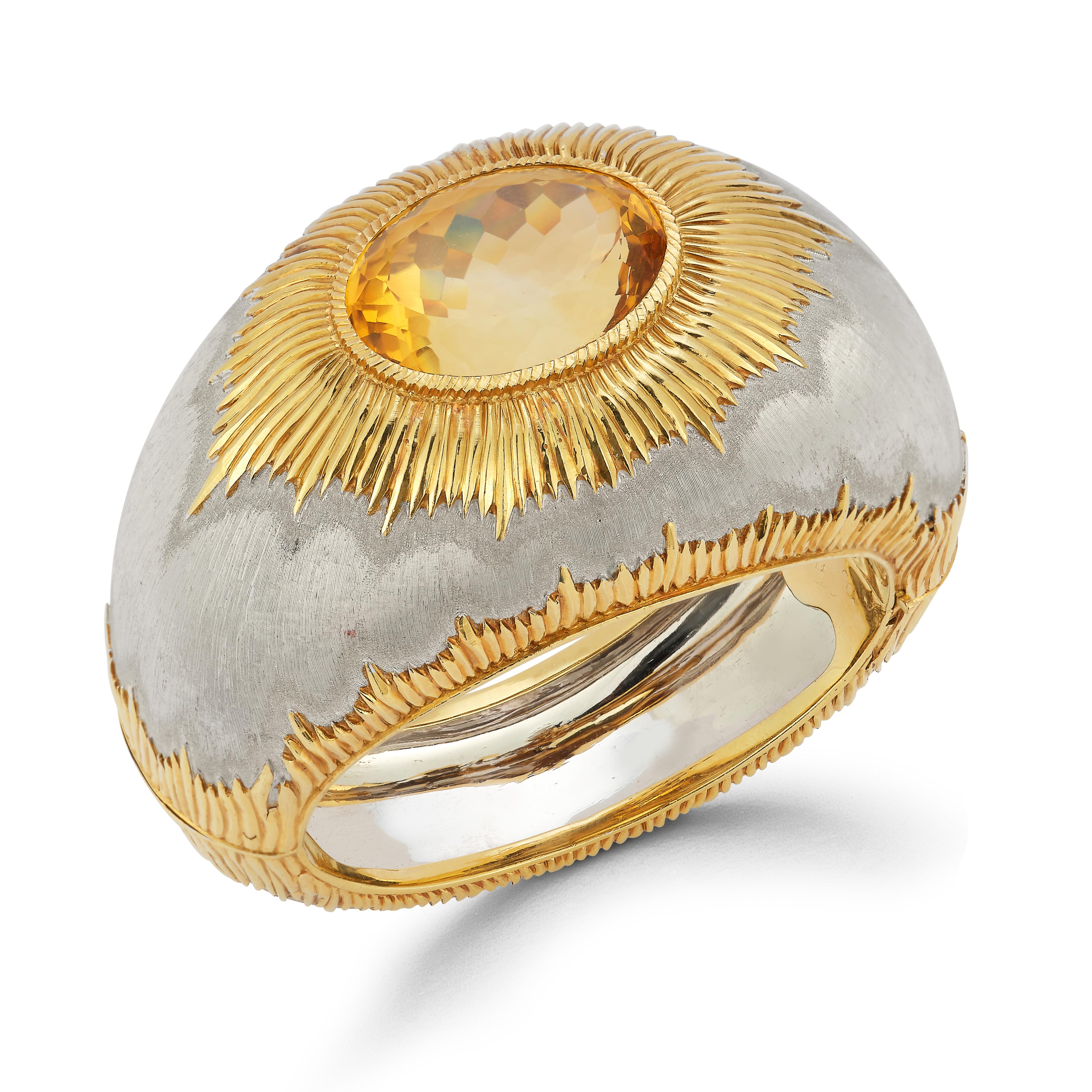 Buccellati Large Citrine Two Tone Gold Bangle Bracelet  

1 large oval cut citrine set in 18 karat white and yellow gold satin finish.

Citrine Weight: approximately 50.00 cts 

Measurements: 3