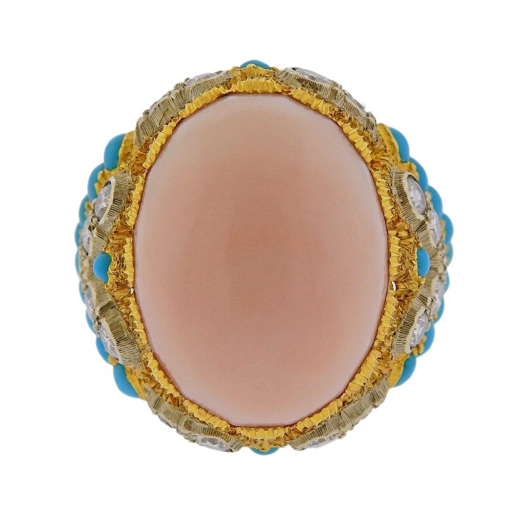 Beautiful 18k yellow gold ring by Buccellati, featuring 13.5ct coral, surrounded with 1.17ctw in H/VS diamonds and 1.82ctw in turquoise. Come with original Buccellati replacement value certificate from 2012 of $51500. Ring size - 6.75, ring top -