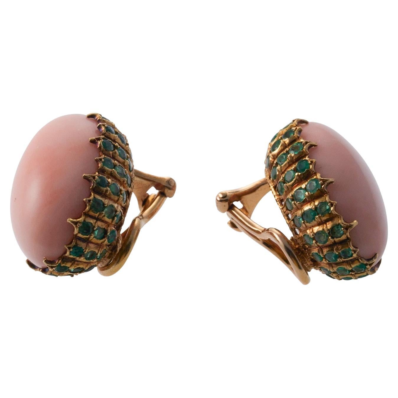 Pair of 18k gold Buccellati earrings set with coral and emeralds. Earrings measure 22mm x 15mm. Marked: Buccellati, Italy, 18k. Weight is 16.4 grams.