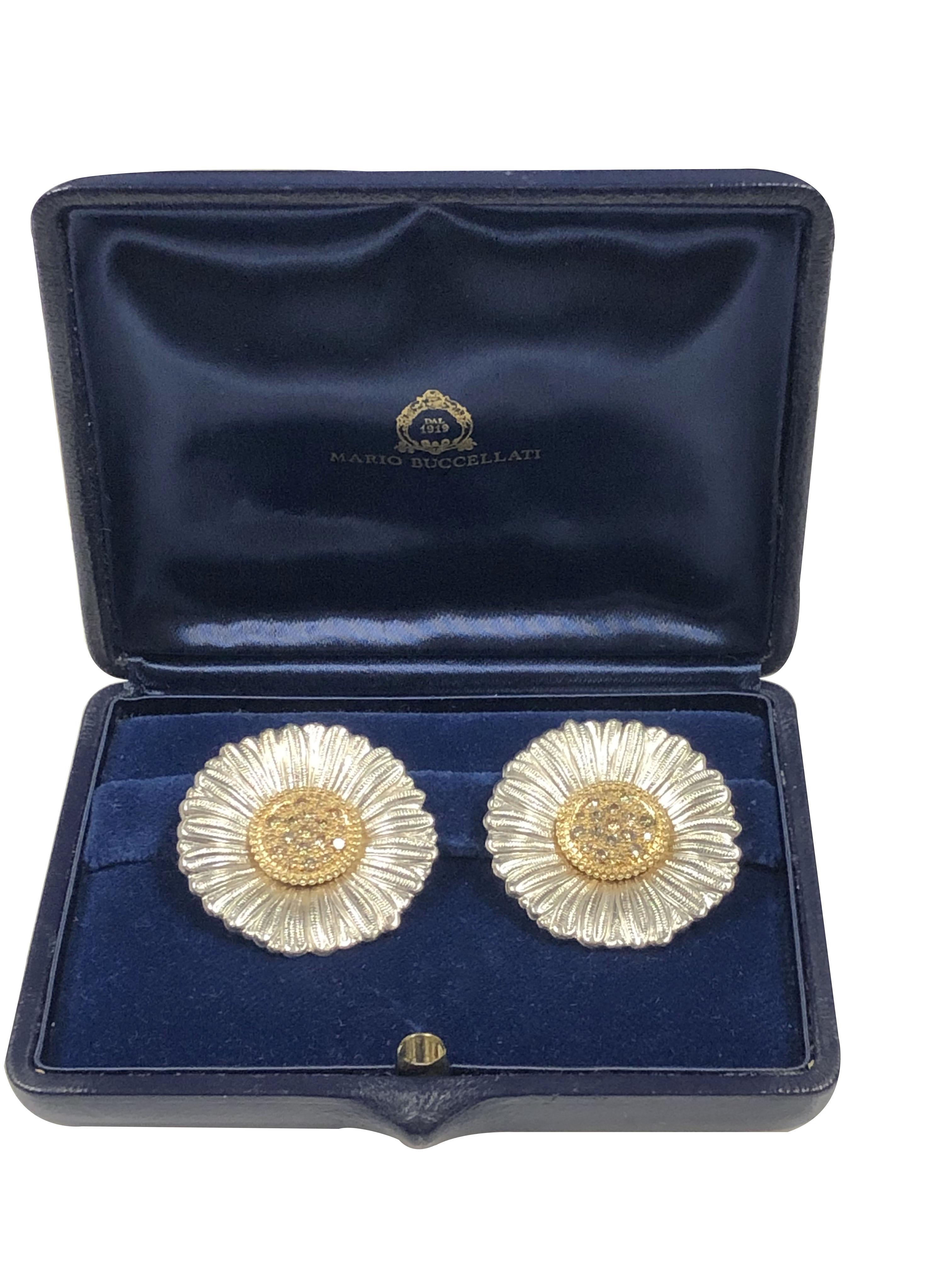 Circa 2010 Buccellati Large Daisy Flower Earrings, measuring 1 1/4 inches in diameter, Gold center and set with brown Round Brilliant cut Diamonds totaling 1 Carat. Pots and these come in the original Presentation Box. 