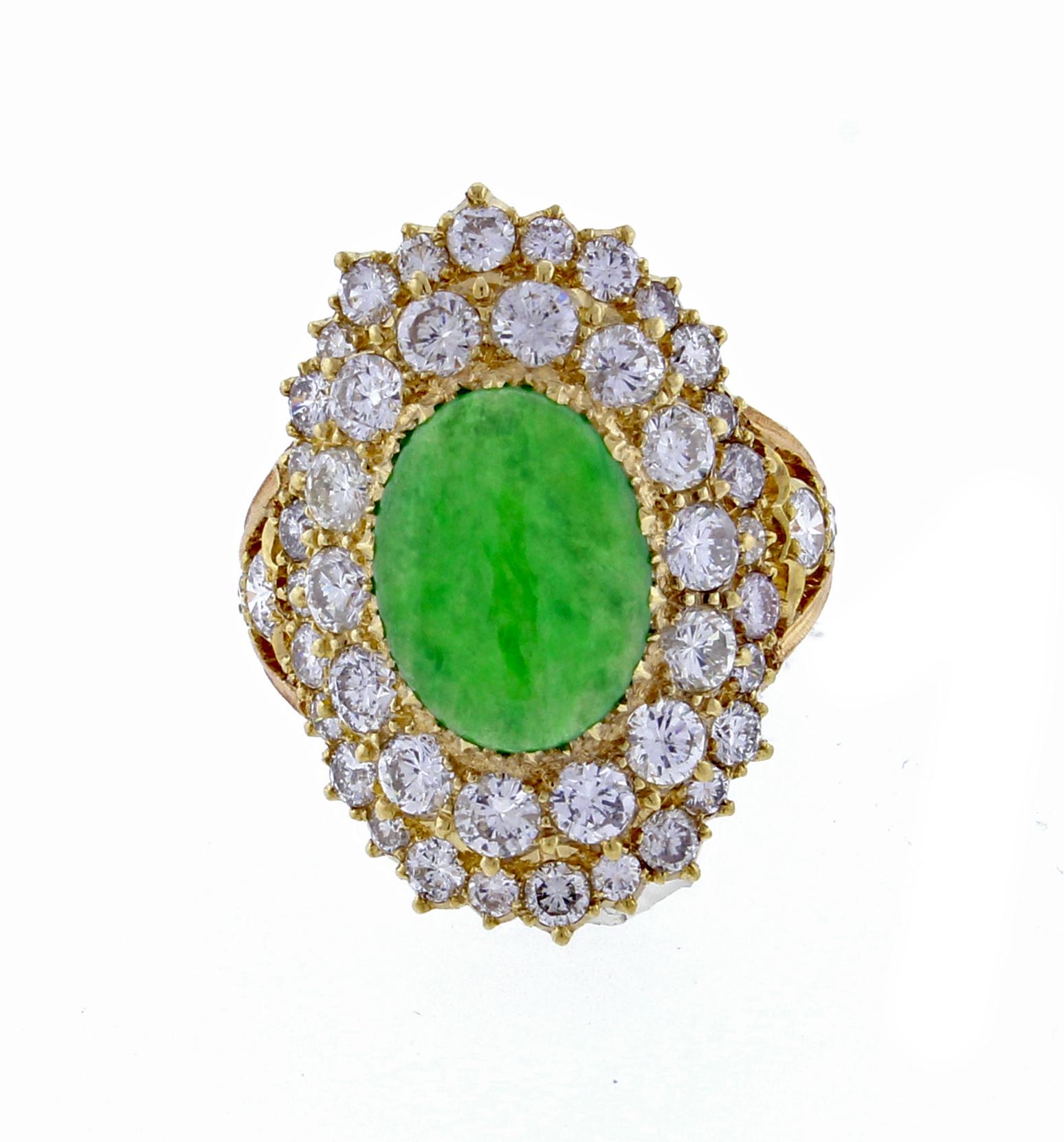 From Italian designer Buccellati, an impressive jade and diamond rising.   The ring features an oval jadeite jade cabochon measureing 12*9.mm and 46 brilliant diamonds weighing approximately 3.15 carats. Handmade by Buccellati in 18 karat pink and