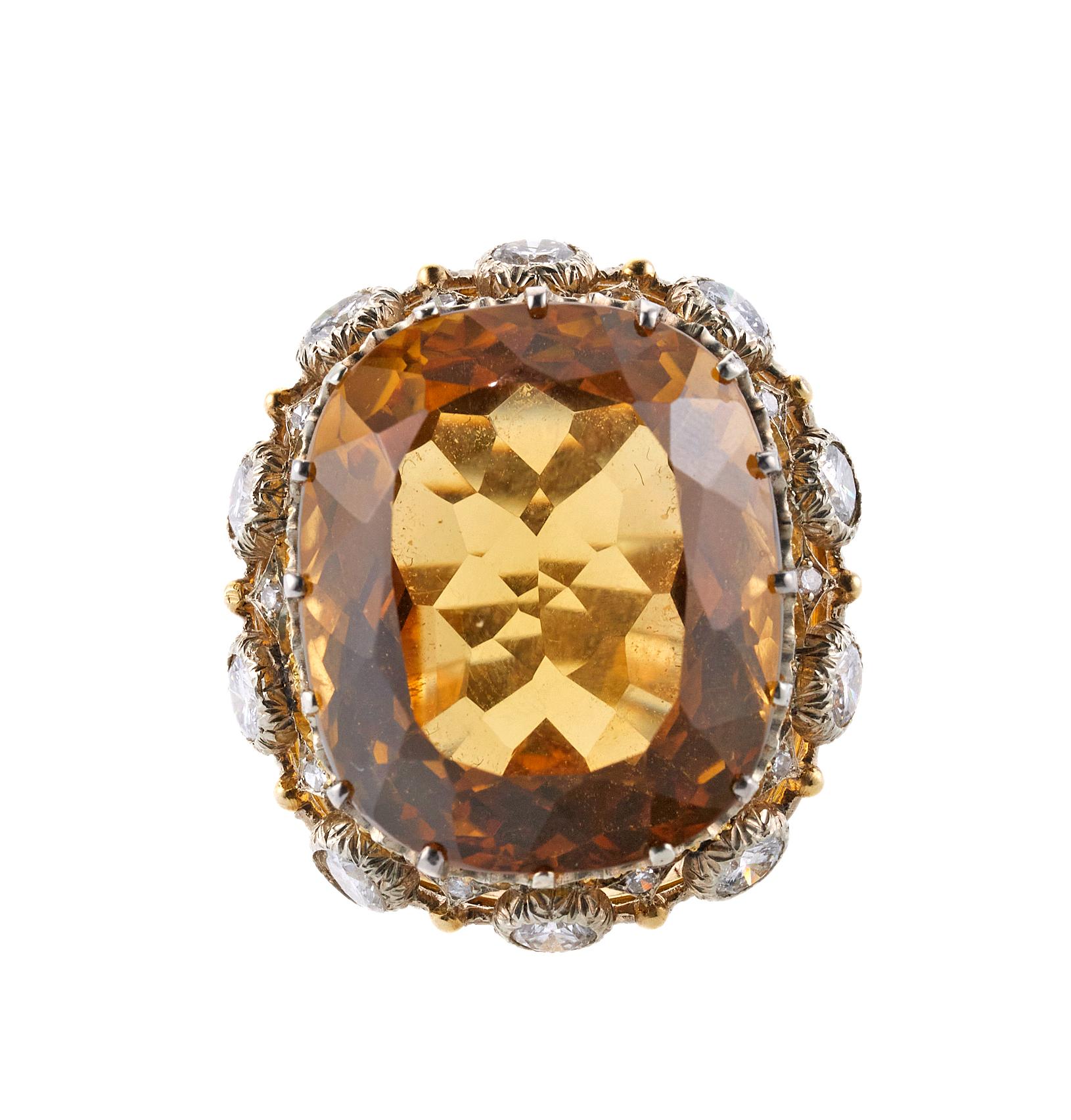 Buccellati cocktail ring in 18K gold, with center 32ct citrine stone measures 23.2mm x 19.9mm x 13.15mm and approx. 2.10ctw in SI/H diamonds. Ring size 6, top measures 30mm x 26mm. Marked: Buccellati, Italy,18k. Weight is 18.0 grams.