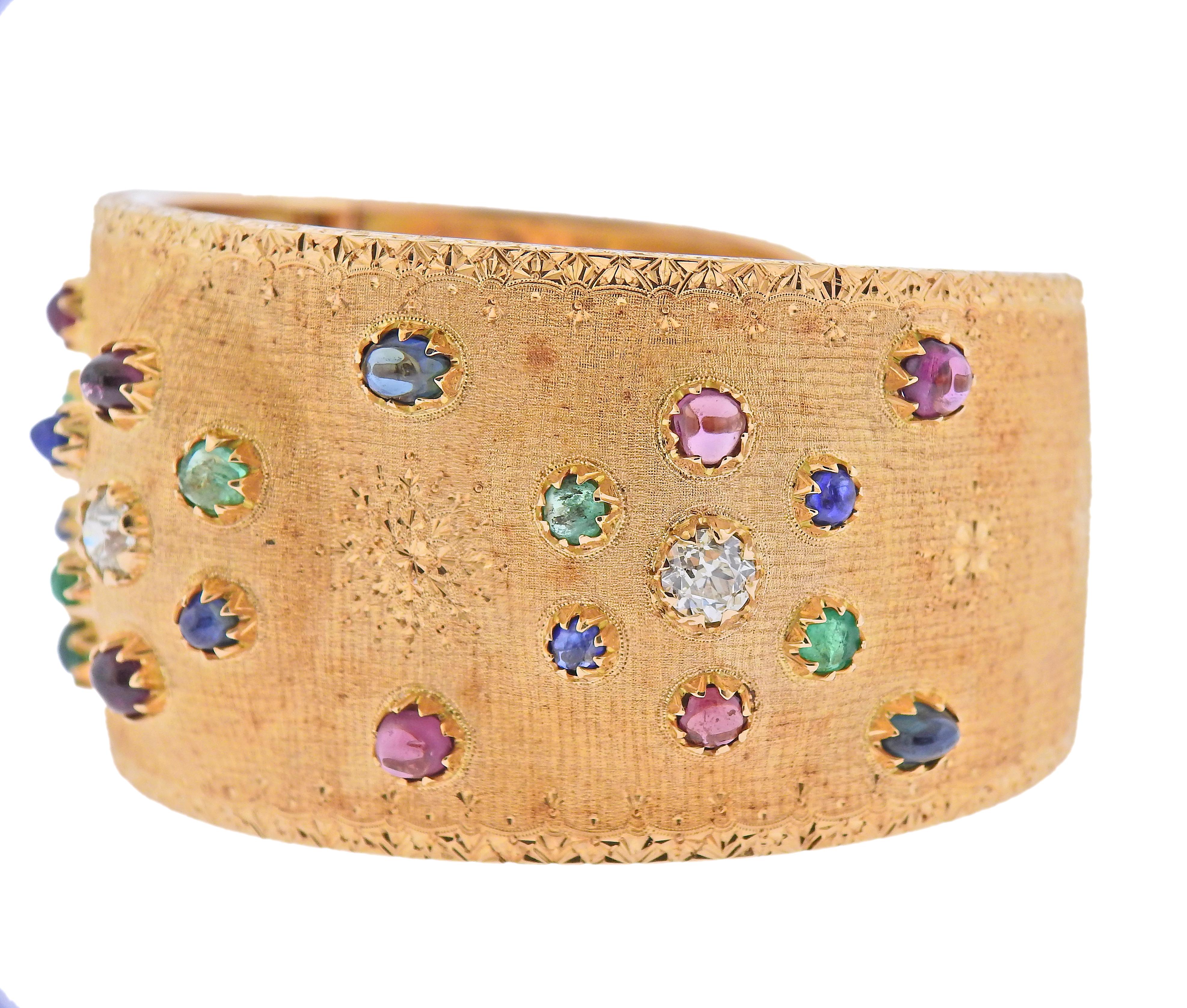 Impressive 18k rose gold cuff bracelet by Buccellati, set with emerald, sapphire, ruby cabochons and approx. 1.70cts in diamonds. Bracelet will fit approx. 7.5