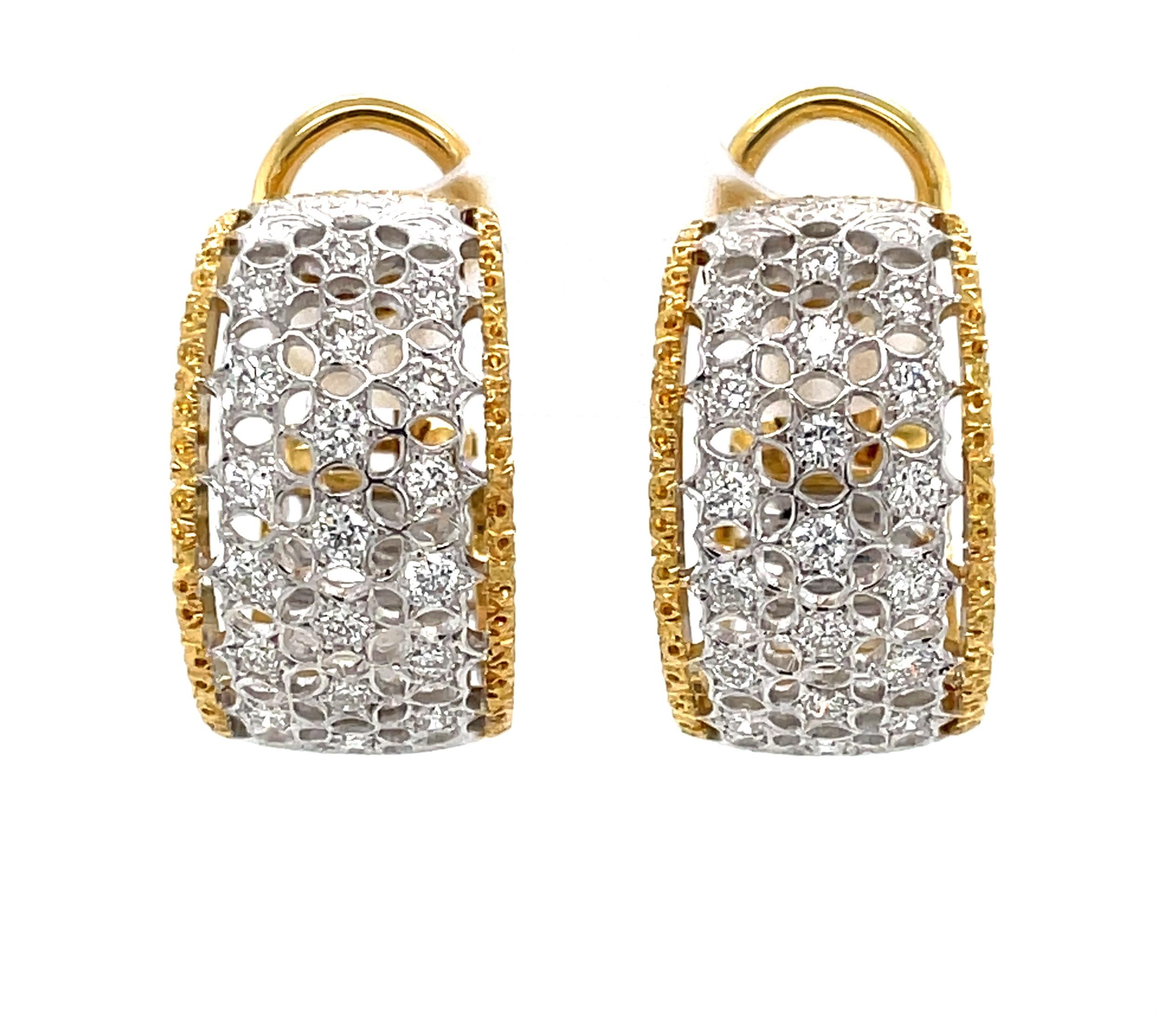 Thirty eight brilliant white H/SI round faceted diamonds with over one carat total weight sparkle on this fabulous pair of sophisticated dress earrings by Buccellati. With a ribbon inspired motif, the  
the half inch wide white gold filigree hoop is