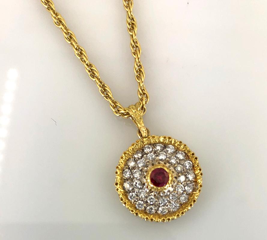 18k yellow gold diamond and ruby pendant with chain, signed Buccellati.
Vintage and estate collection