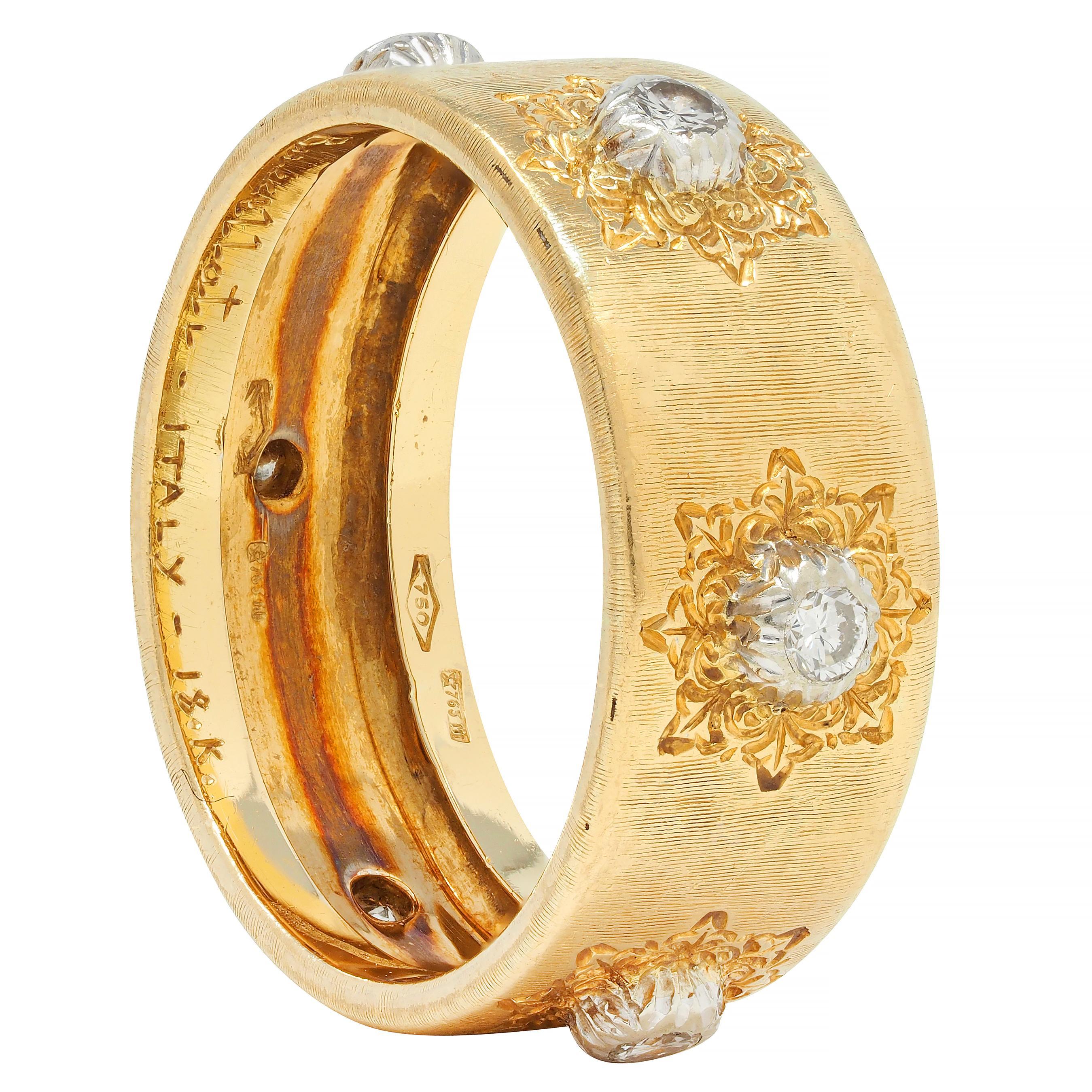 Designed as a wide yellow gold band with very fine linear rigato texture throughout 
Featuring six white gold stations atop an engraved lace motif
Each centering a round brilliant cut diamond
Weighing approximately 0.18 carat total
Eye clean and