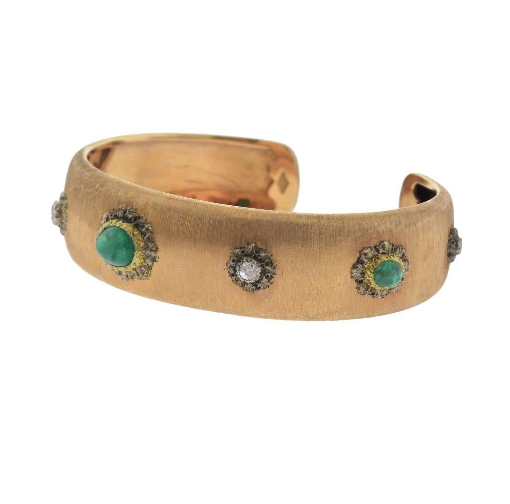  Classic 18k yellow gold cuff bracelet, crafted by Buccellati, set with emerald cabochons and approx. 0.12ctw in diamonds. Bracelet will fit approx. 6 3/4