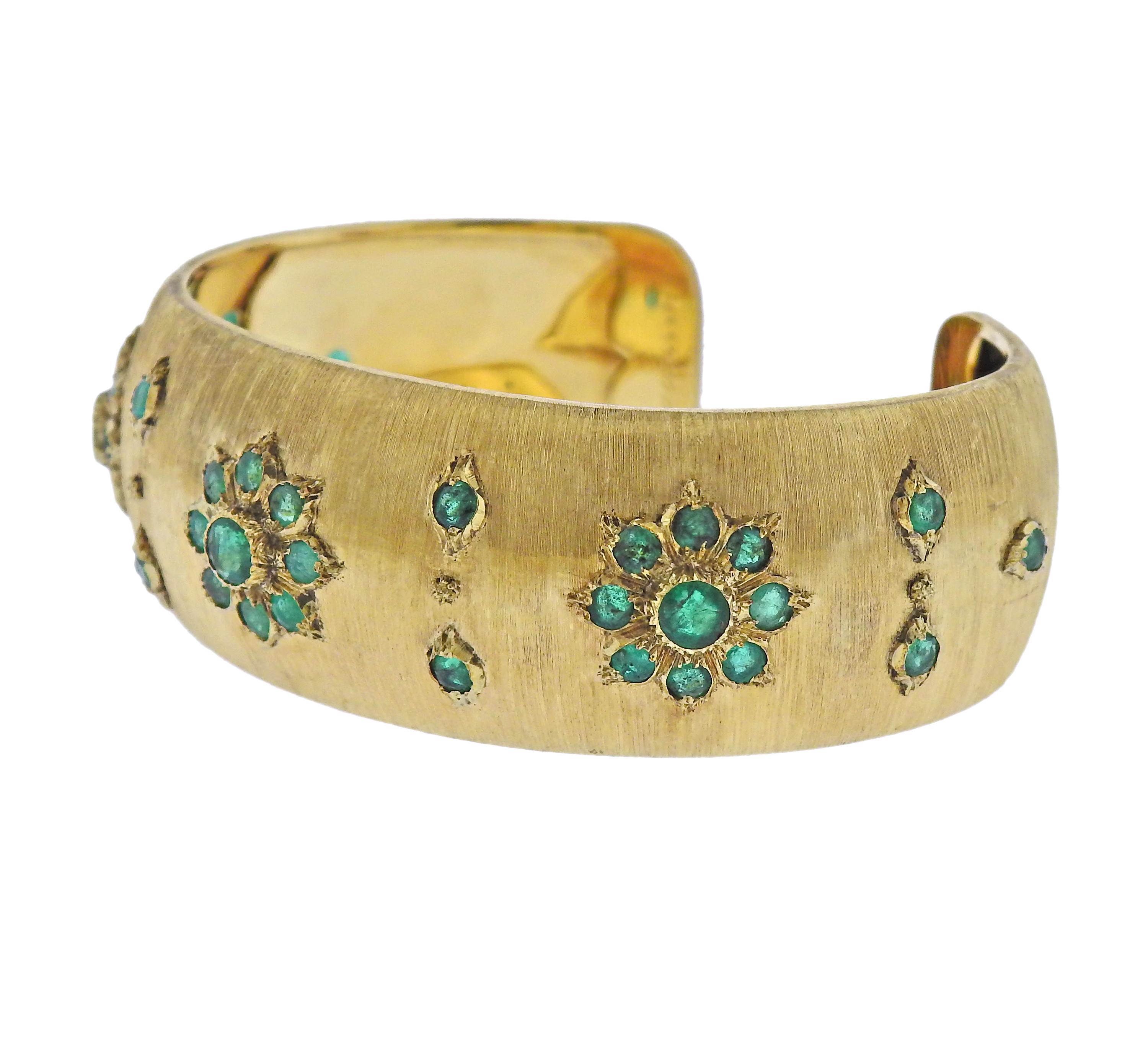 Classic 18k yellow gold cuff bracelet with emeralds, crafted by Buccellati. Bracelet will fit up to 7.25