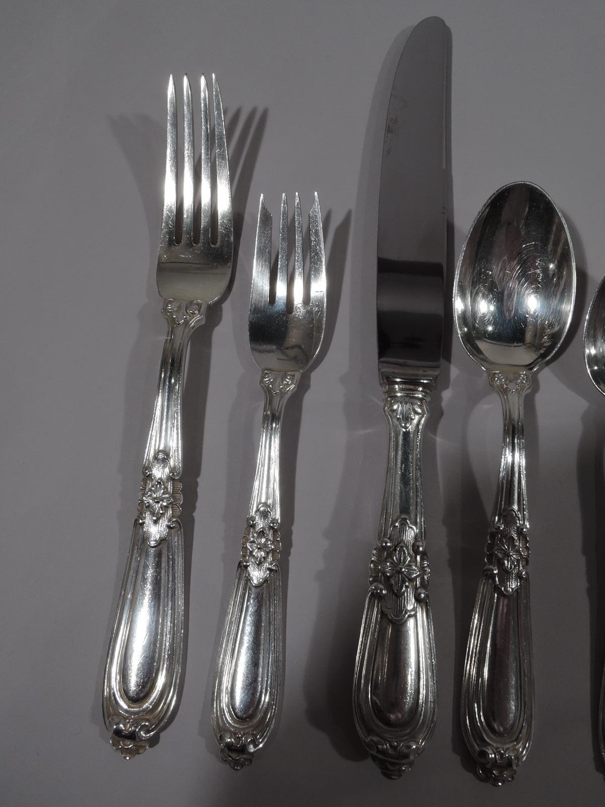 Esteval sterling silver dinner set for 12. Made by Buccellati in Milan, circa 1950. This set comprises 77 pieces pieces (dimensions in inches): Forks: 12 dinner forks (8 5/8) and 12 salad forks (6 7/8); Spoons: 12 soup spoons (6 7/8) and 24