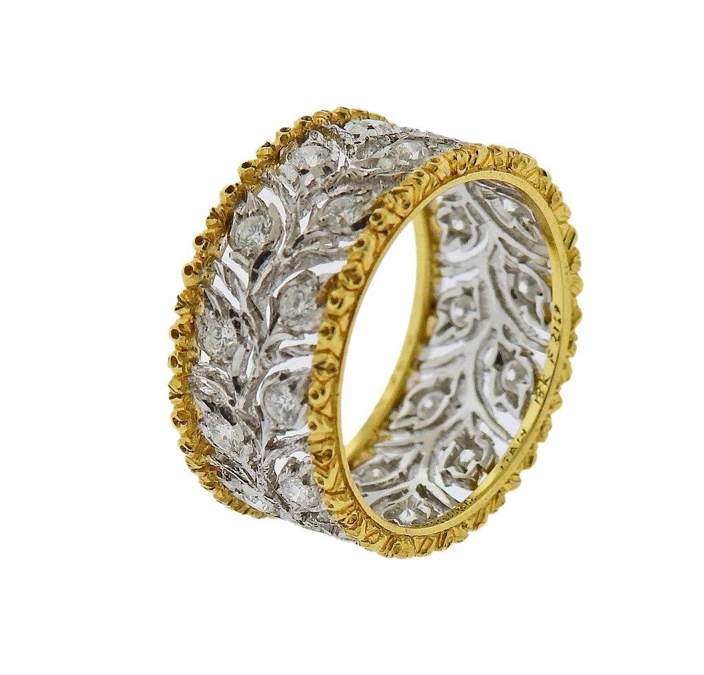 Beautiful 18k white and yellow gold wedding band ring, set with approx. 0.69ctw in H/VS diamonds. Ring size - 6, ring is 9.4mm wide. Marked - Buccellati, Italy, 18k, 750, F2169. Weight - 5.3 grams. 

