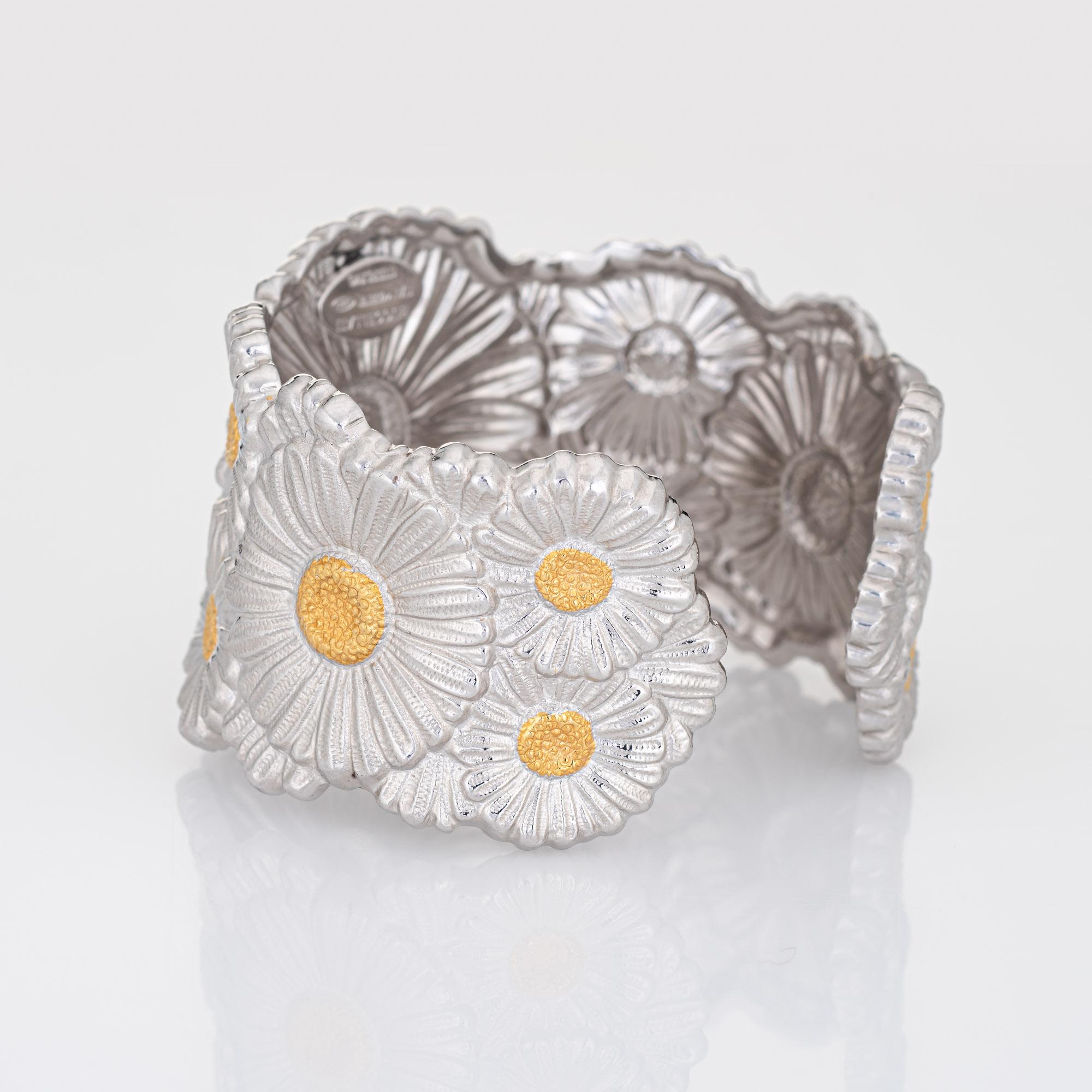 Stylish and finely detailed Buccellati flower cuff bracelet, crafted in sterling silver with gold plated accents.  

The elaborate cuff features daisy flowers with yellow gold plated centers. The Italian jewelry house, Buccellati, is famed for its