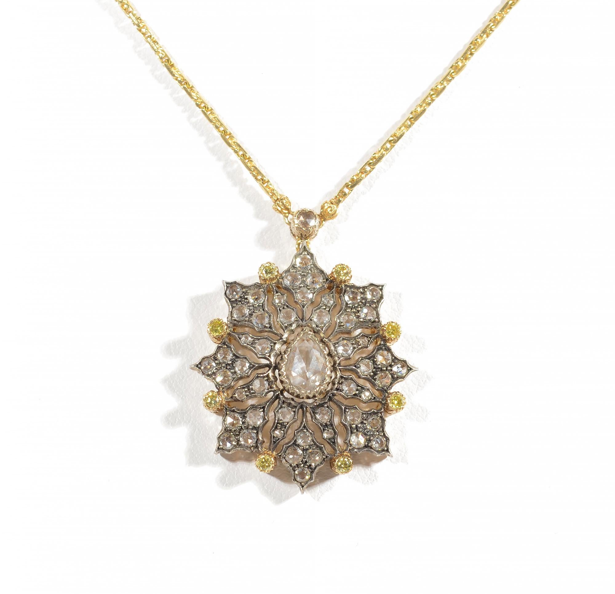 Delicate pendant necklace by Buccellati with rose cut and yellow diamonds. The pear shaped center stone is approximately 4.5 carats of an H color; VS clarity rose cut diamond. The eight point star-like design is made of 49 rose cut diamonds with a