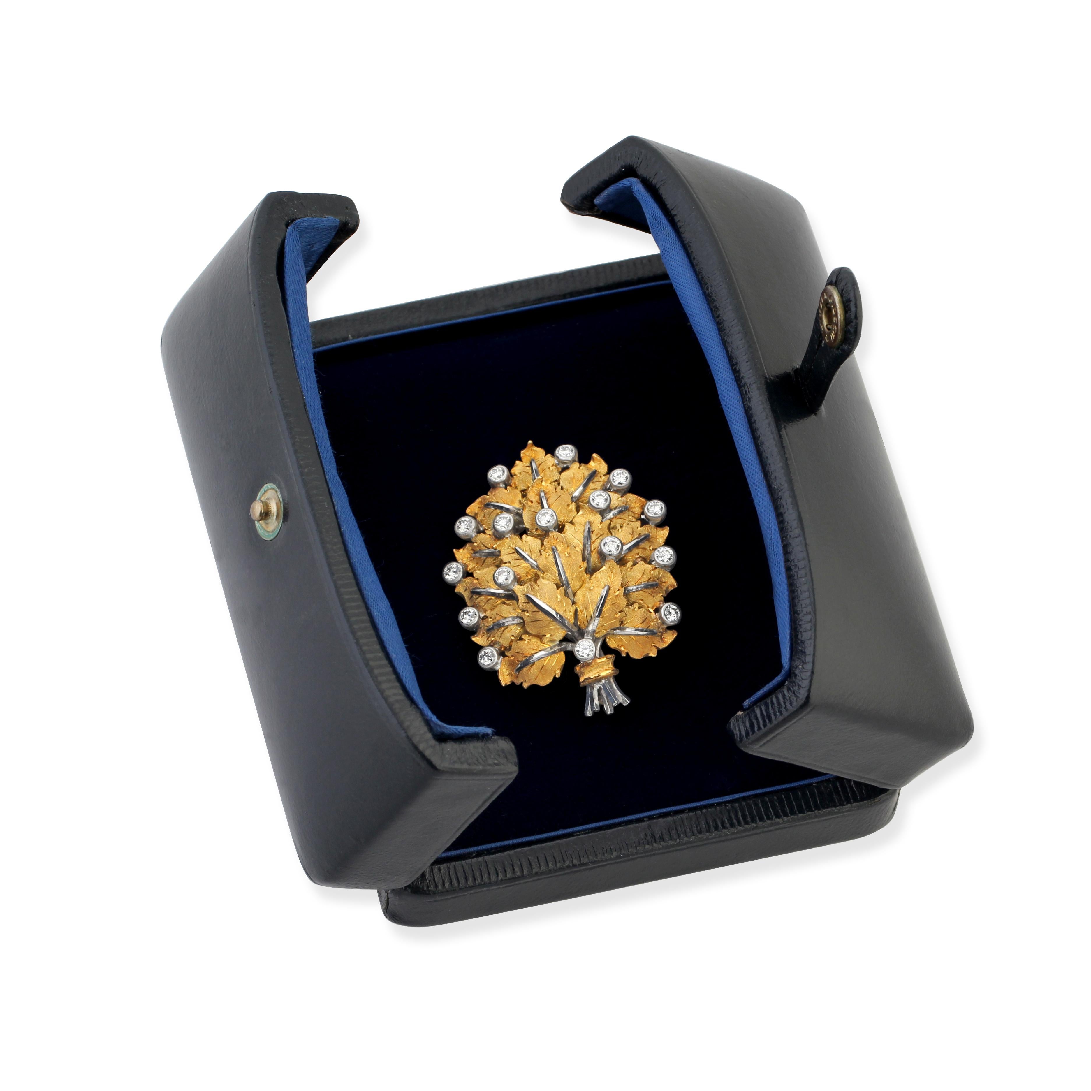 A bi-colour gold and diamond leaf brooch by  Buccellati in a fitted box, signed Federico Buccellati.
