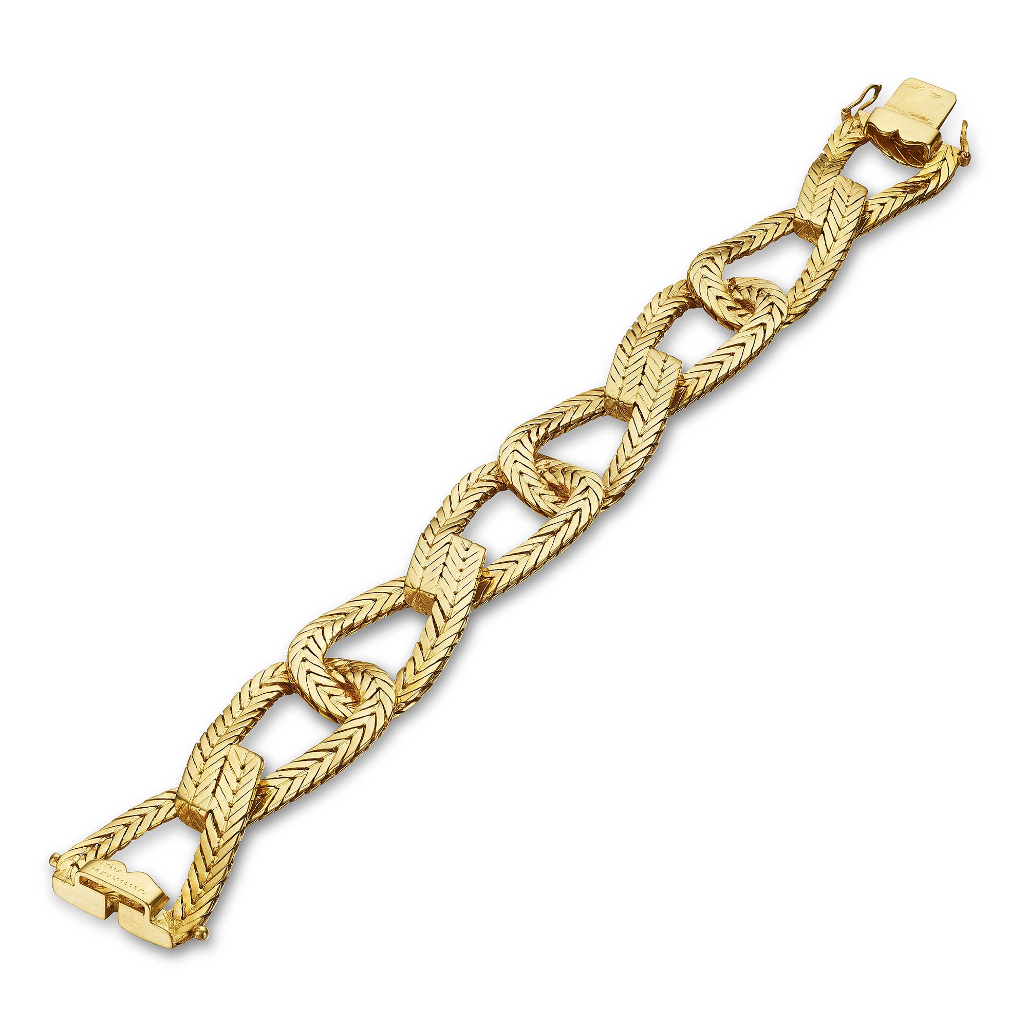 With a eye-catching front and back herringbone pattern and long and lean flexible links, this handmade 1970's Buccellati 18 karat honeyed yellow gold bracelet is total sophistication.  Signed M. Buccellati.  7 3/4