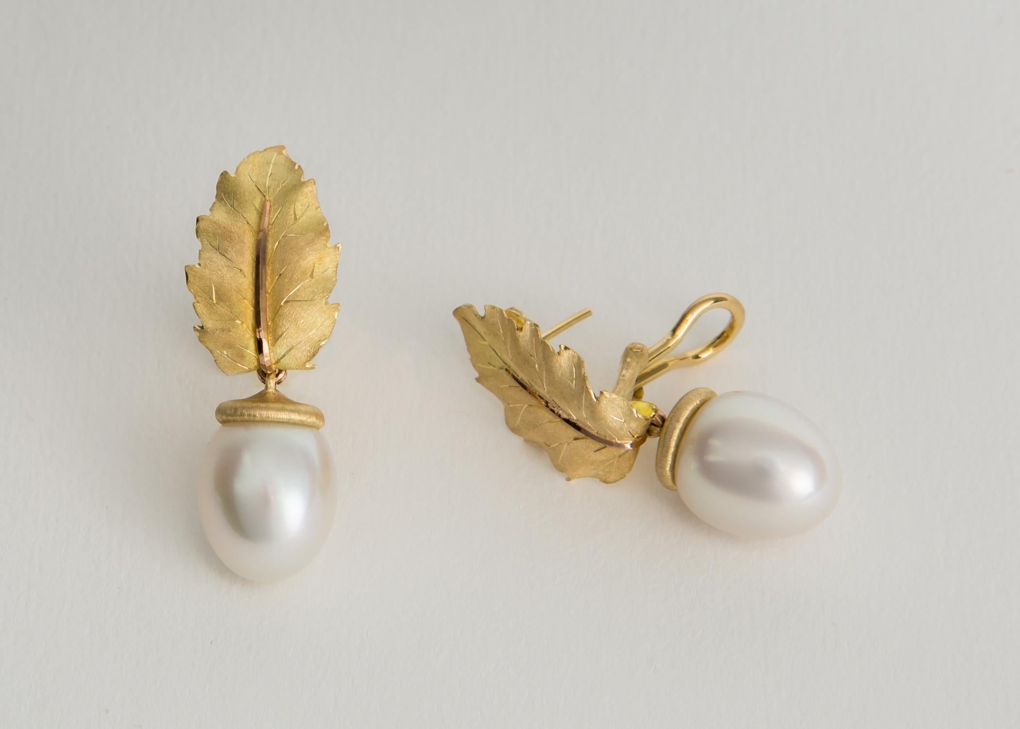 Buccellati's classic leaf motif earrings featuring an exceptional pair of south sea pearls 15.0 x 12.4mm 1 5/8 inches in length. Vintage, Classic, Chic !!!