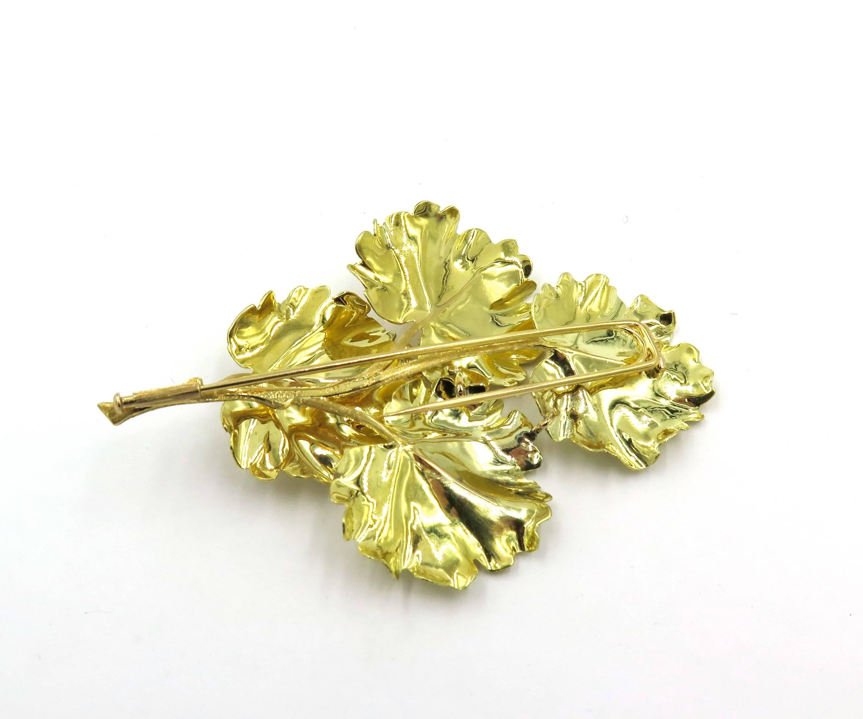 An 18 karat yellow gold brooch. Mario Buccellati. Circa 1960. Designed as textured geranium leaves on a stem. Length is approximately 3 1/4 inches. Gross weight is approximately 27.9 grams. Stamped M. Buccellati, Italy. 
