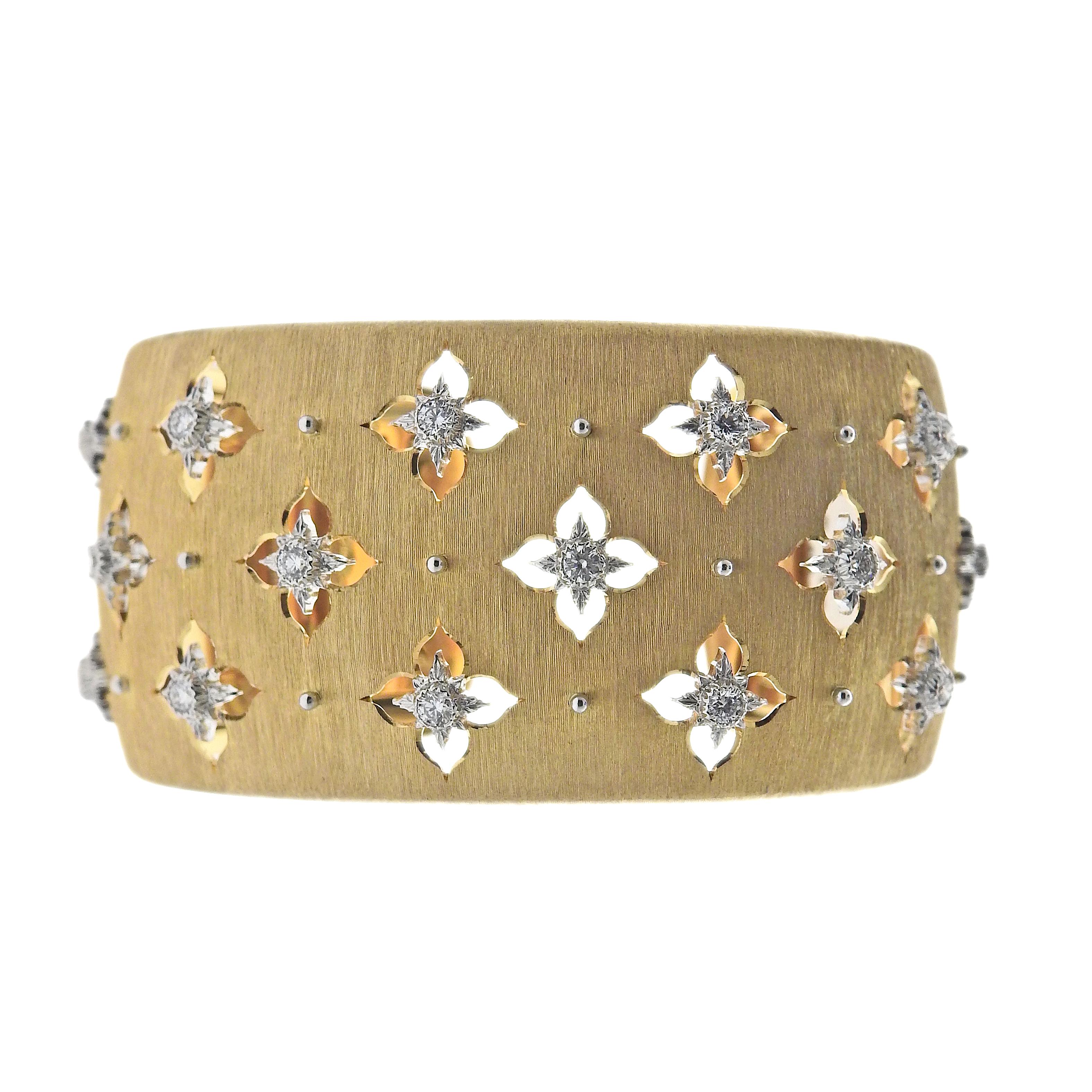 Buccellati 18K gold Macri Giglio cuff bracelet set with 0.75ctw in VS/FG diamonds. Bracelet measures 59mm circumference (15cm), width is 3cm. Marked: Buccellati italian marks, Au750, W18M1U. Weight is 63.3 grams.
