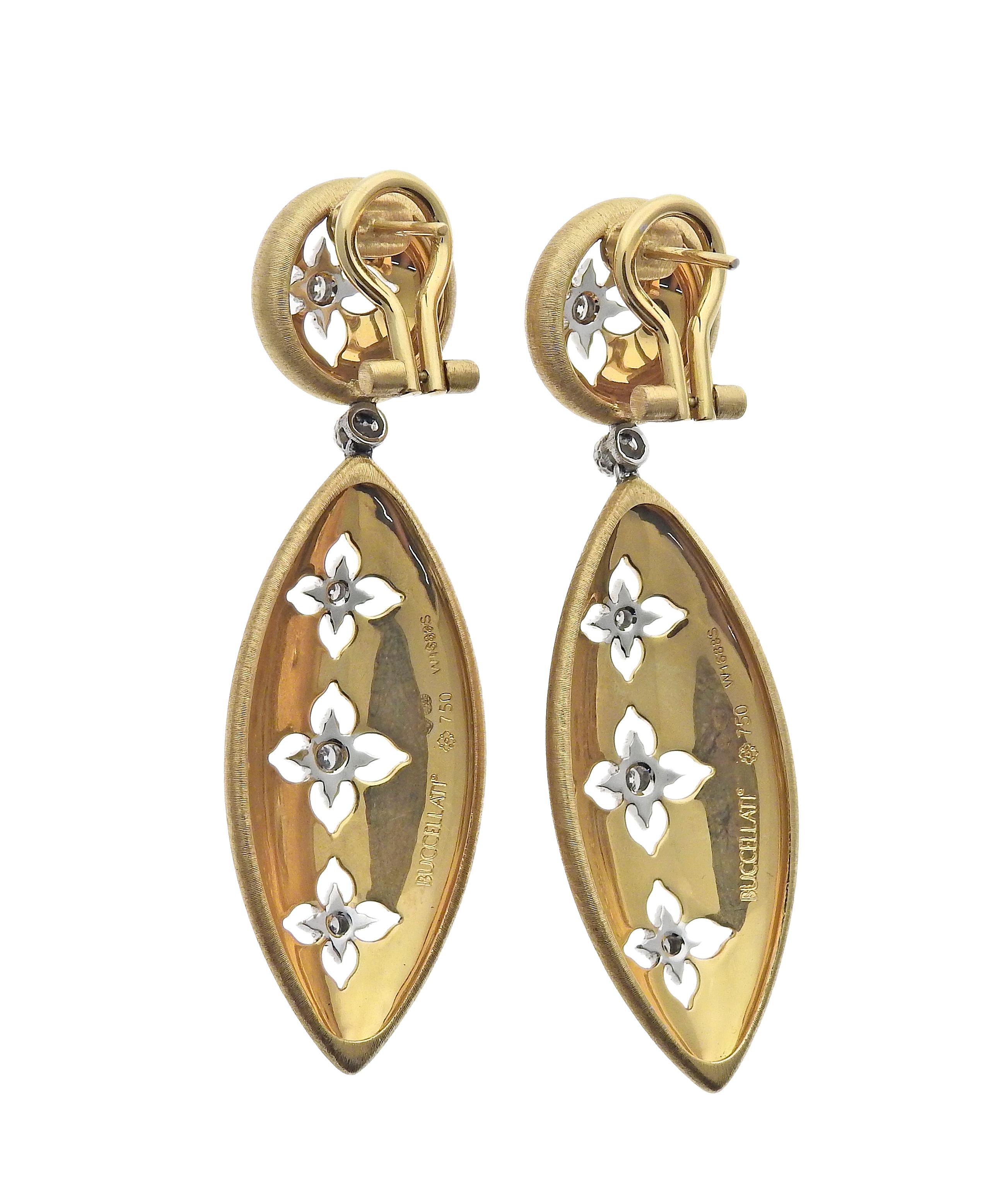 Buccellati yellow and white gold Macri Giglio drop earrings feature 0.25ctw in VS/FG diamonds. Earrings are 55mm long and 17mm at the widest point, top button is 13mm in diameter. Marked: Buccellati Italian marks, Au 750, W 1688S. Weight is 20.4